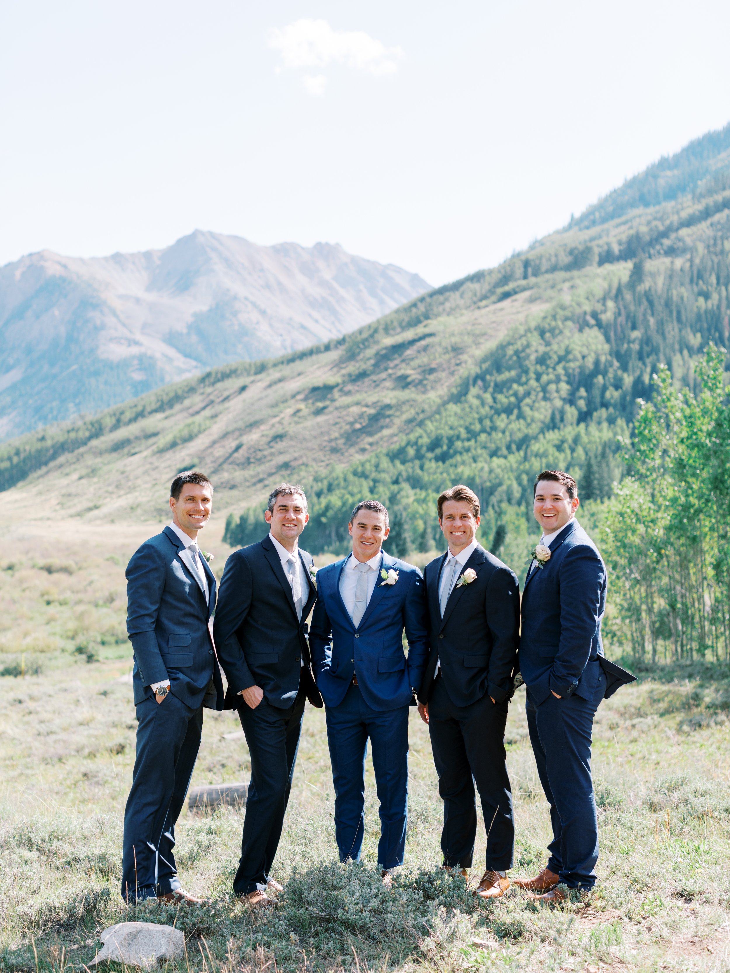 groomsmen in colorado wedding in blue suits.