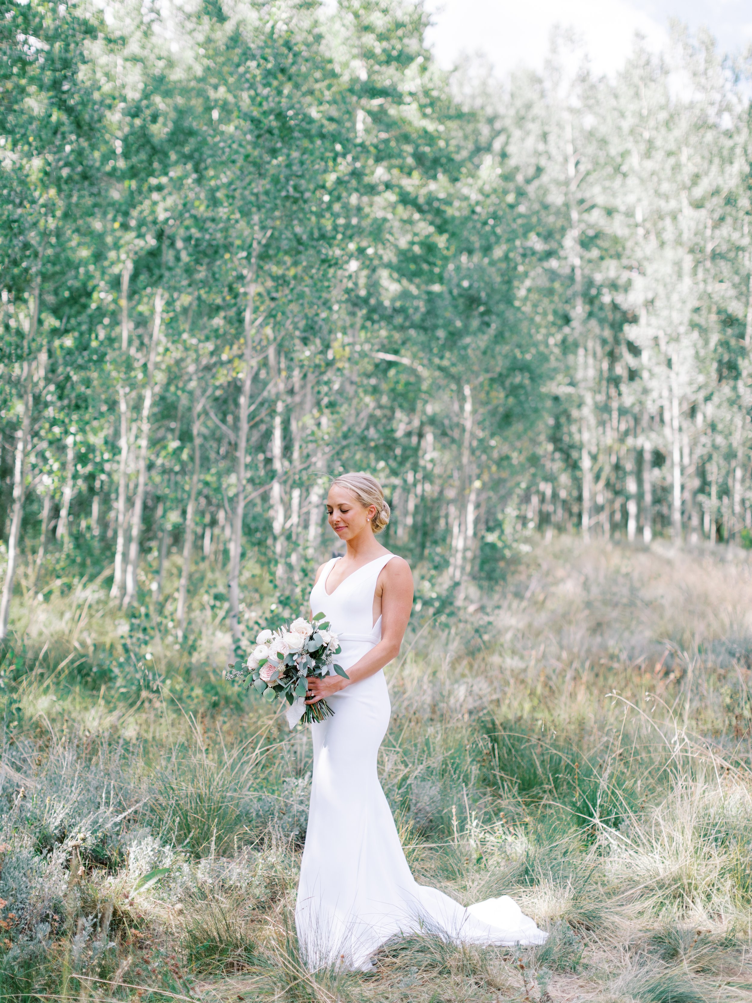 a simple and chic crepe wedding dress worn by this real aandbabe in her ashcroft colorado wedding,