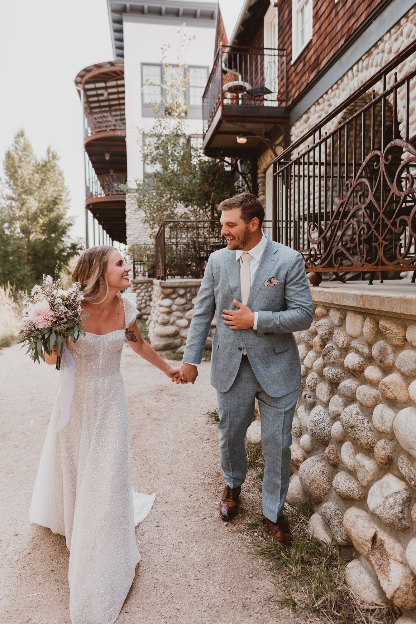 a colorado rustic and cool wedding featuring a alena leena beaded wedding dress at the surf hotel.