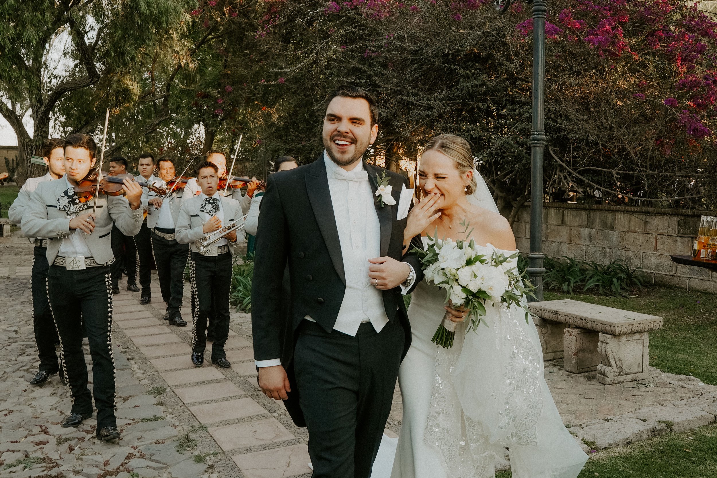 wedding mariachi band for this mexico destination wedding featuring a chic off the shoulder crepe gown. 