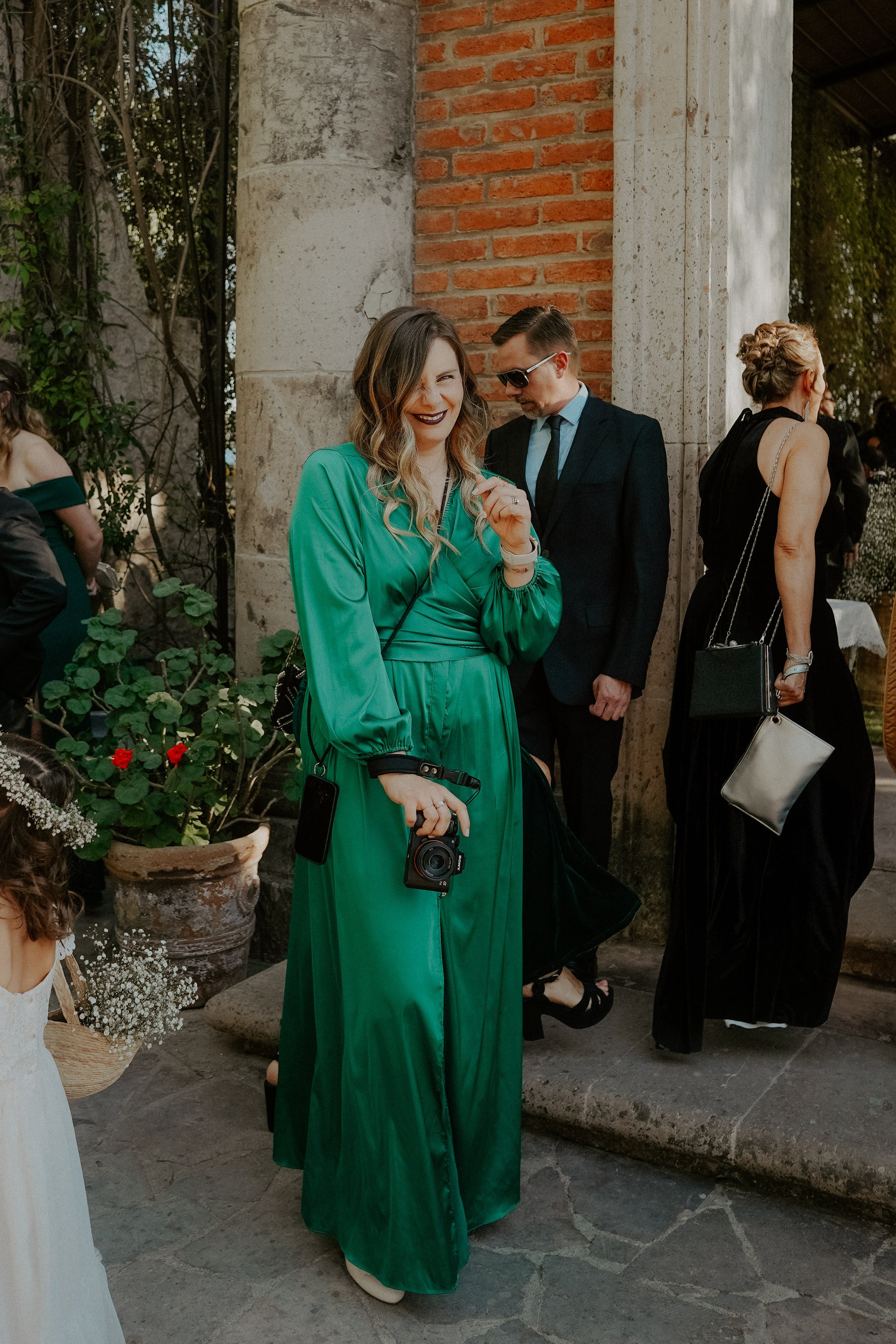 unique wedding guest outfit in a emerald green tone.