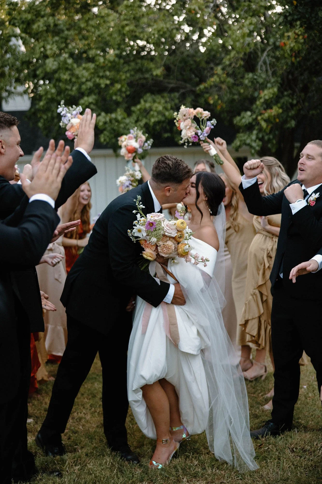 a romantic wedding exit with the bride wearing vagabond.