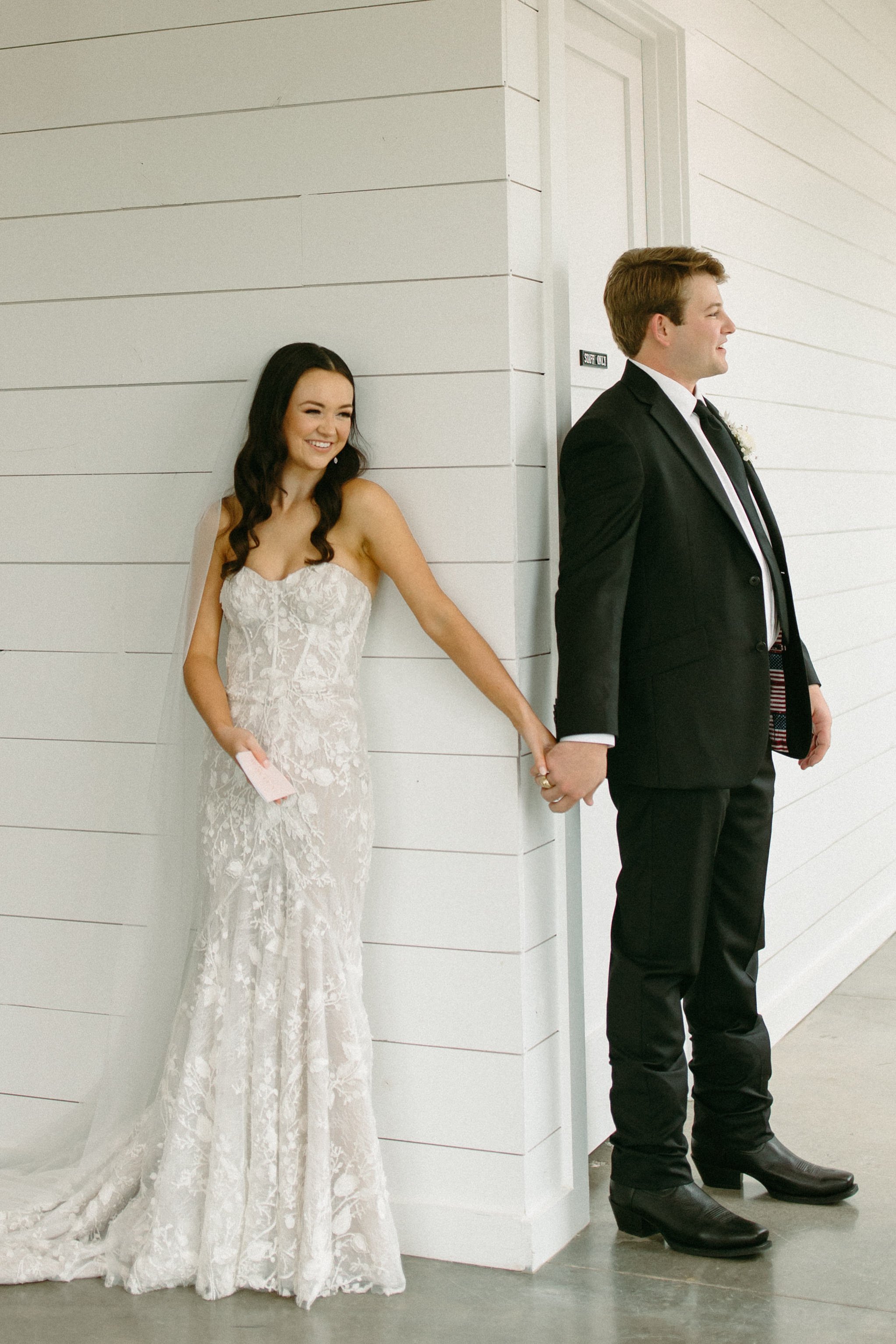 romantic and cute first look with the bride and groom at the gardenia wedding venue in texas.