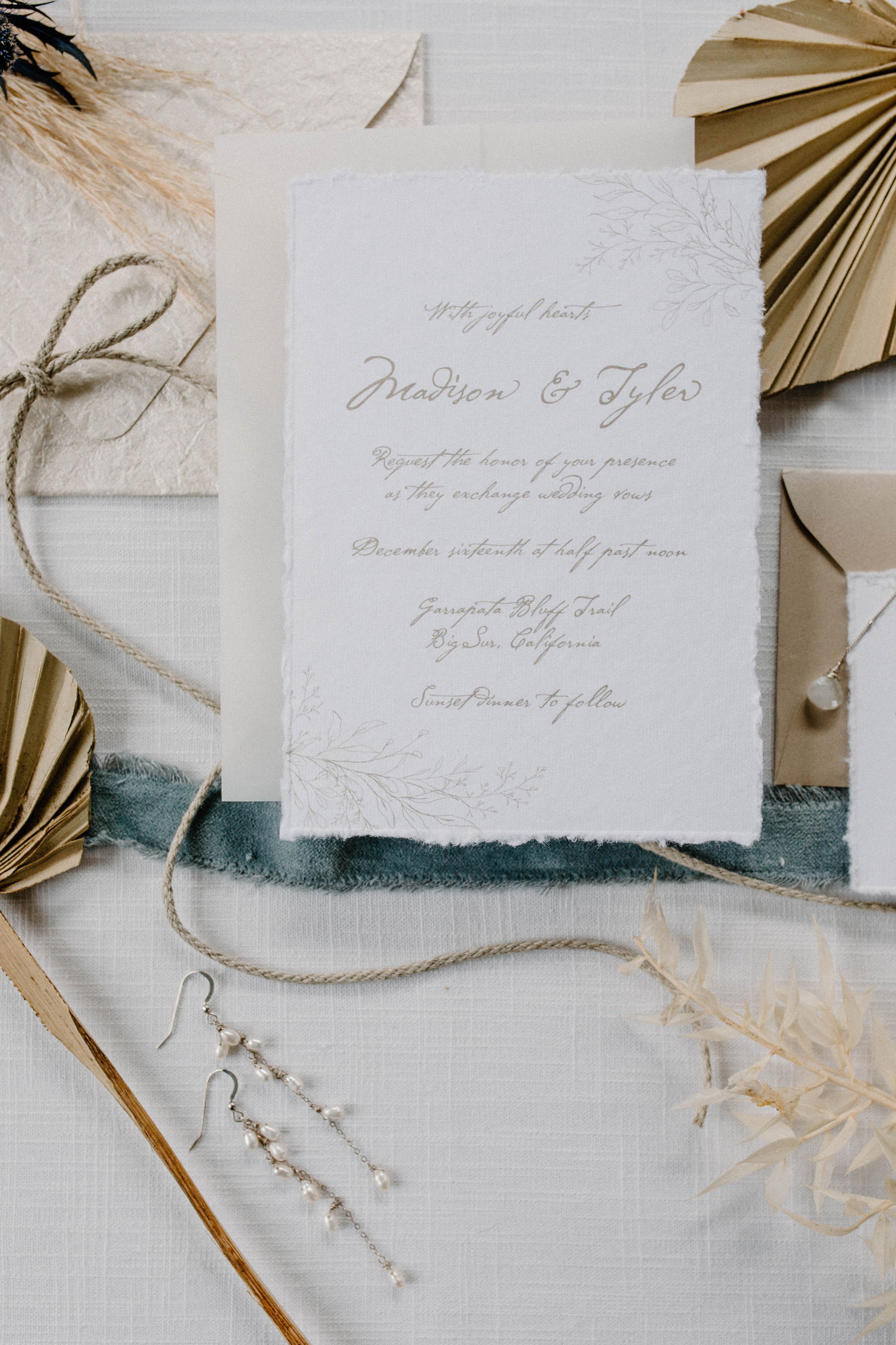 romantic beachy wedding invitations featuring palms and hand-dyed ribbon