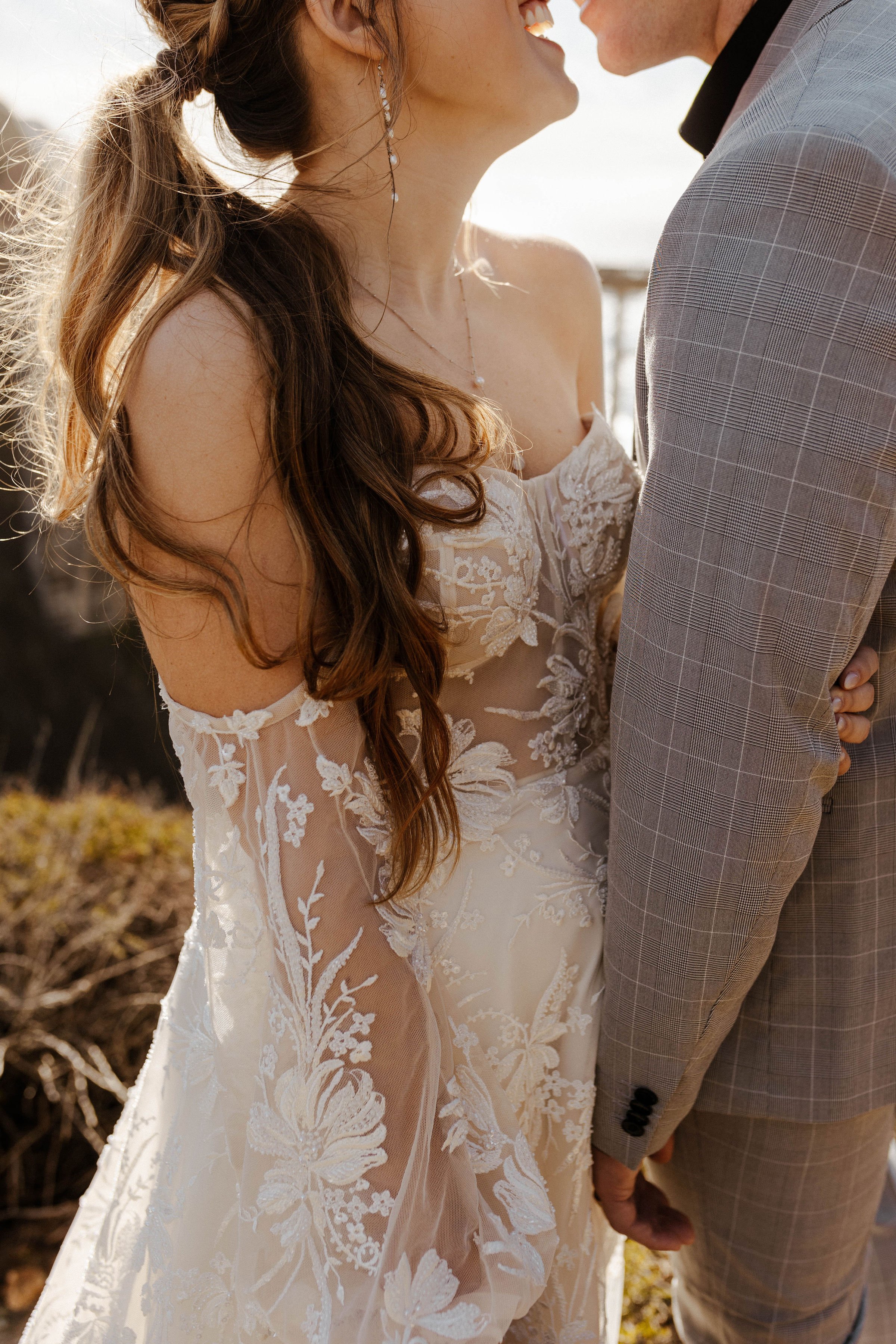 a romantic and boho wedding dress with sleeves in a beachy styled bridal shoot