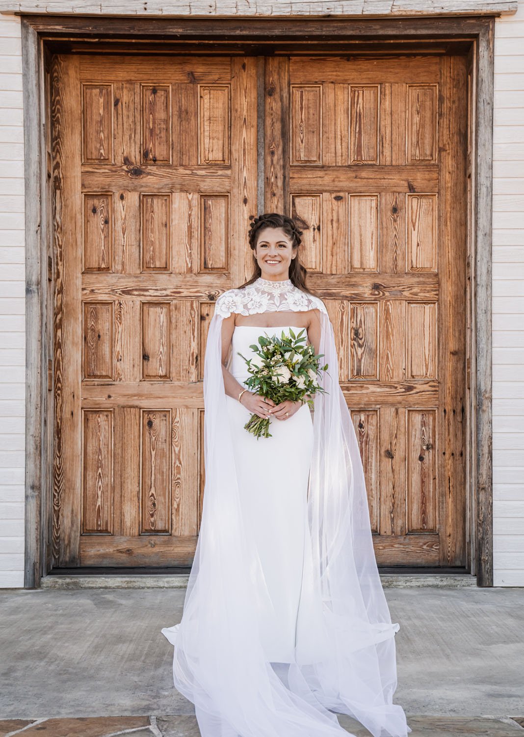 a texas countryside chapel wedding featuring an alyssa kristin simple crepe dress with bridal cape