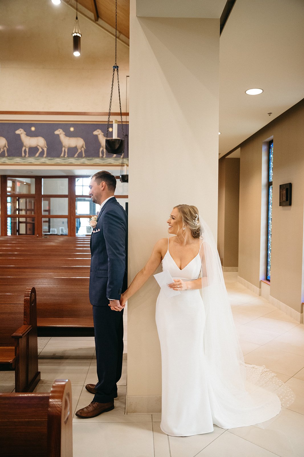 church wedding portraits with a romantic first look in the chapel