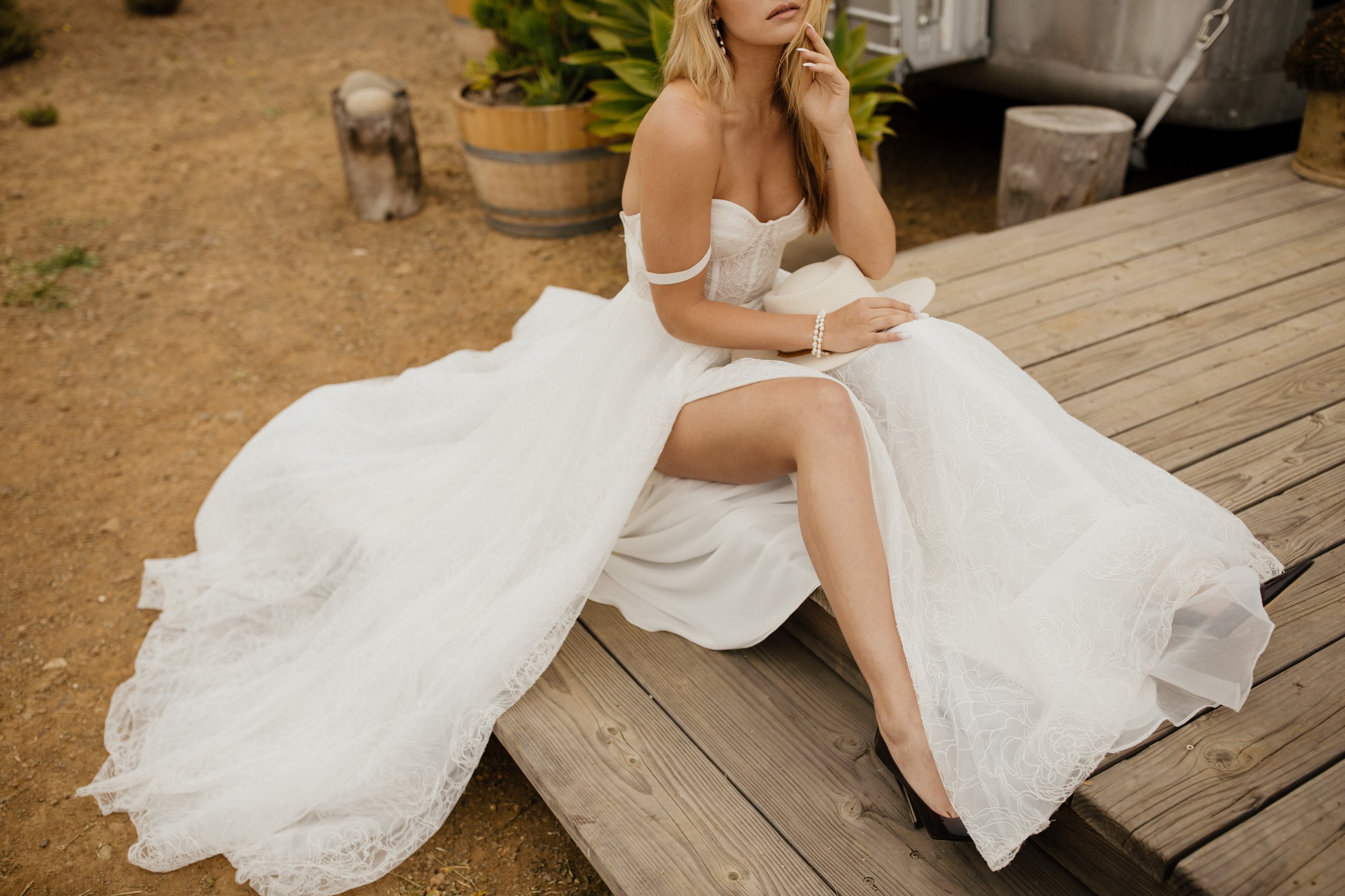 a glamourous a-line wedding dress with a bustier bodice and flowy a-line skirt by tara lauren