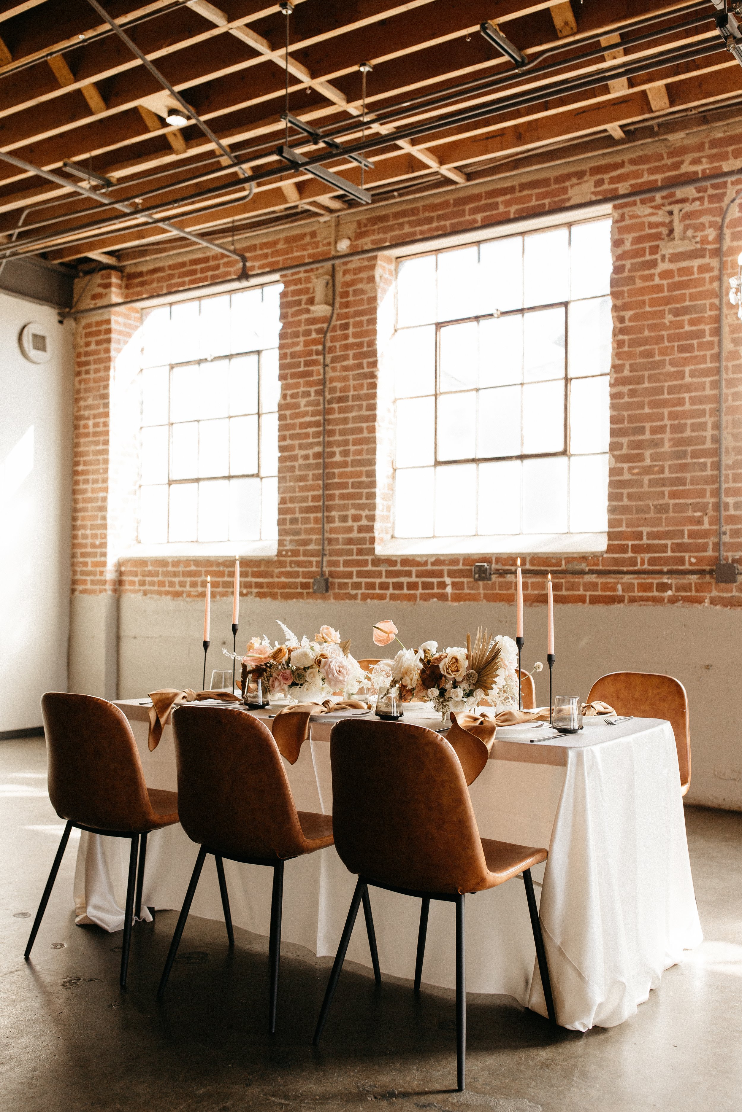 modern and stylish autumn styled wedding reception in an industrial space