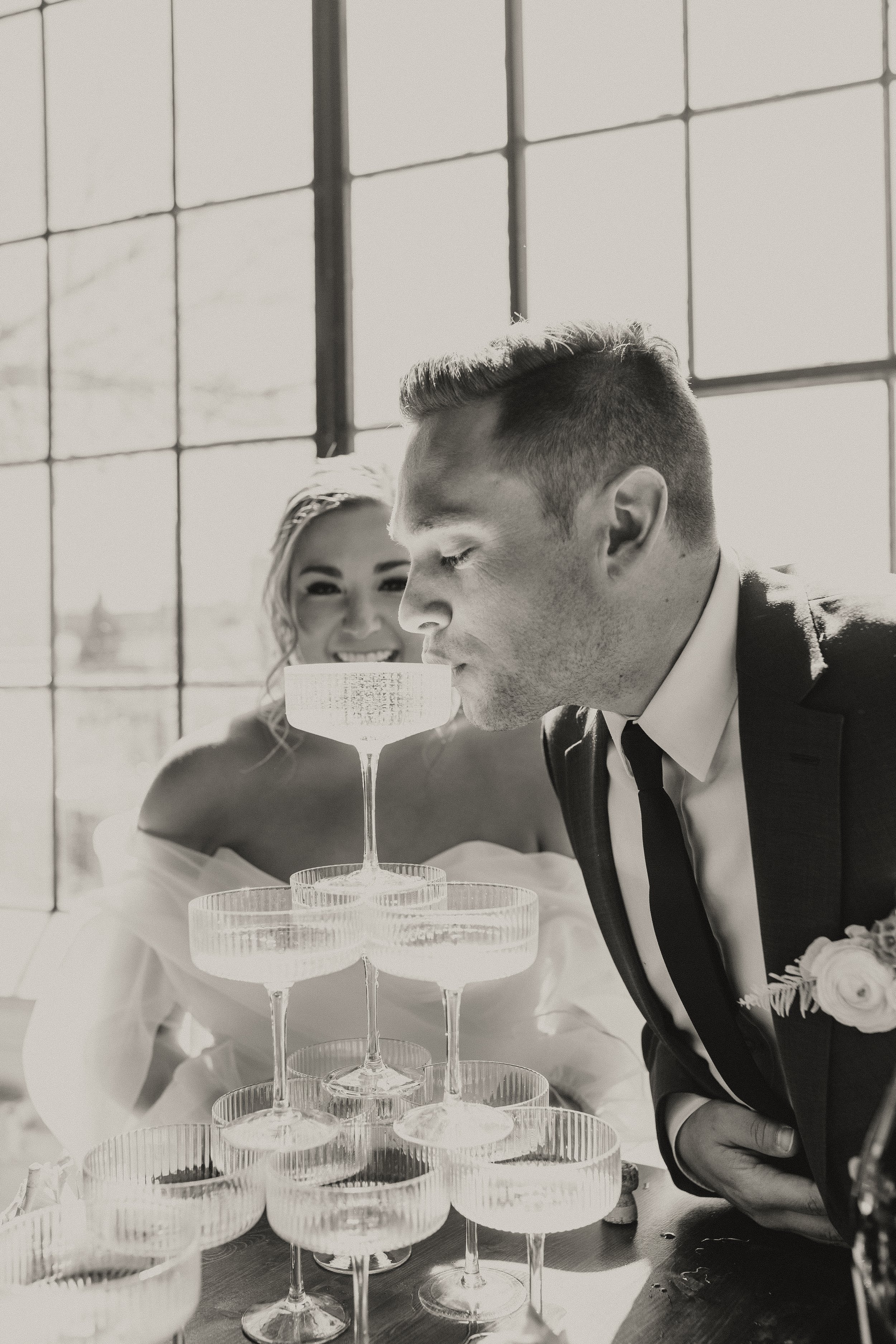 a champagne tower for this modern and industrial styled wedding