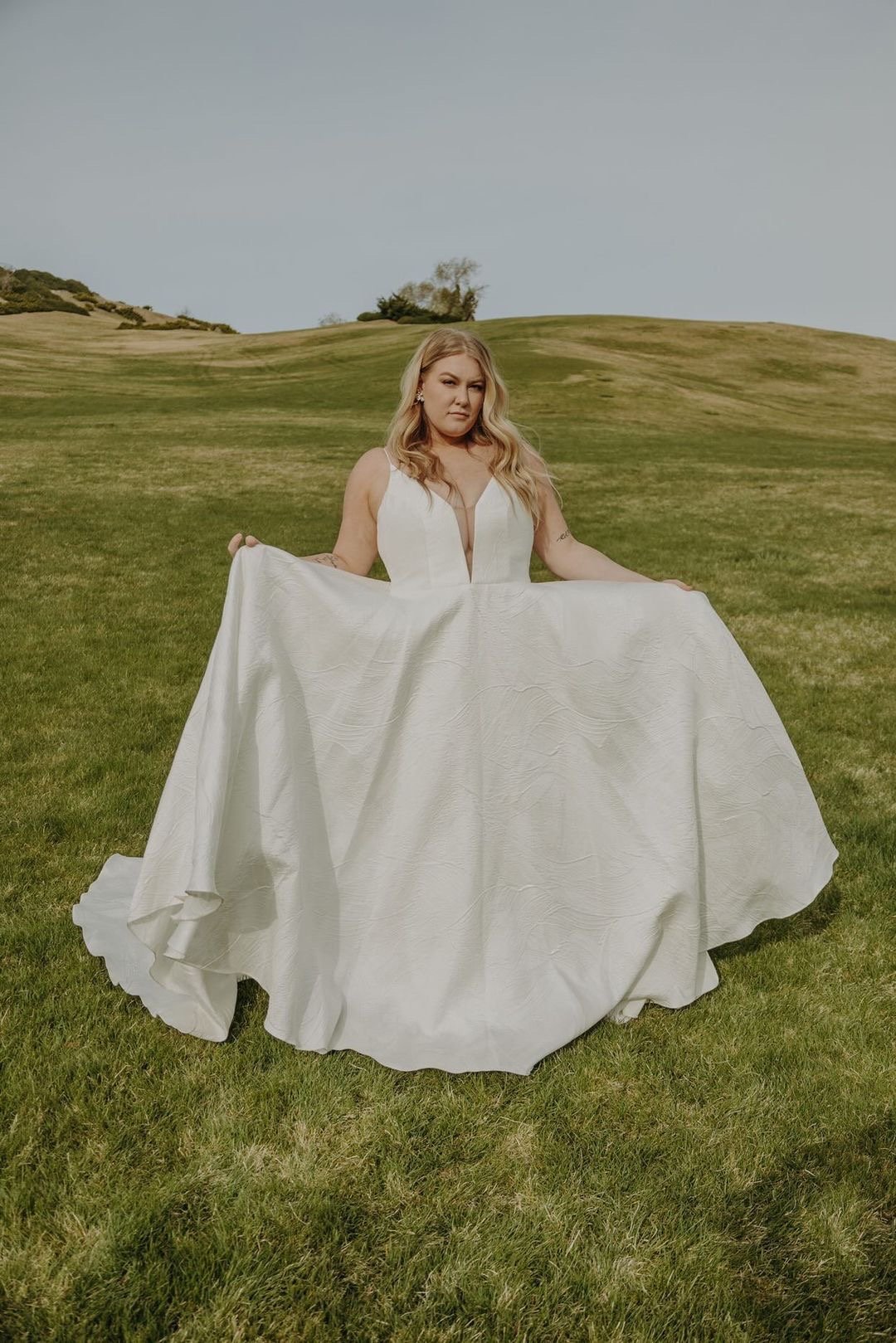 lucinda by truvelle wedding dress on a plus size model