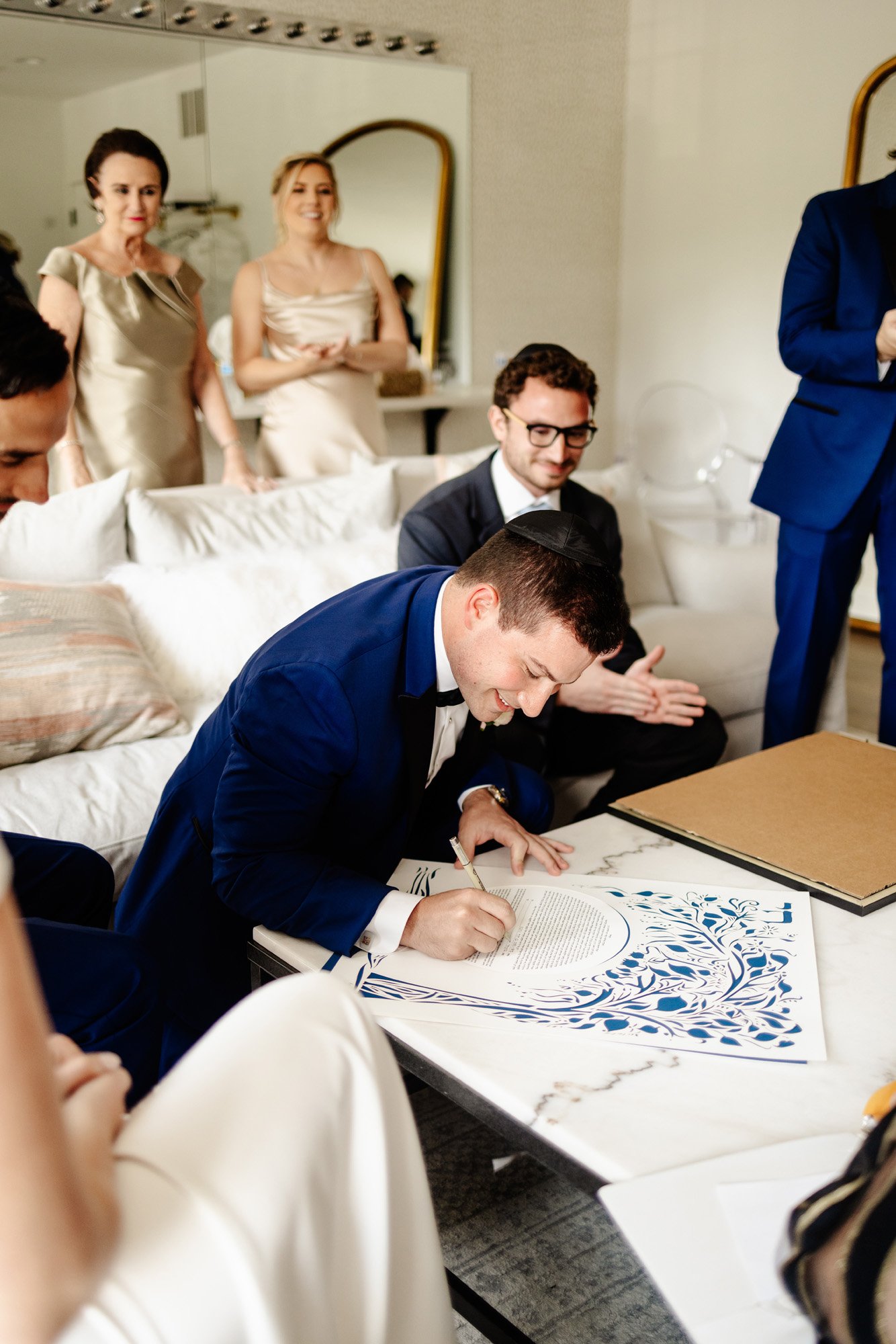 a modern groom portrait featuring the signing of the ketuba