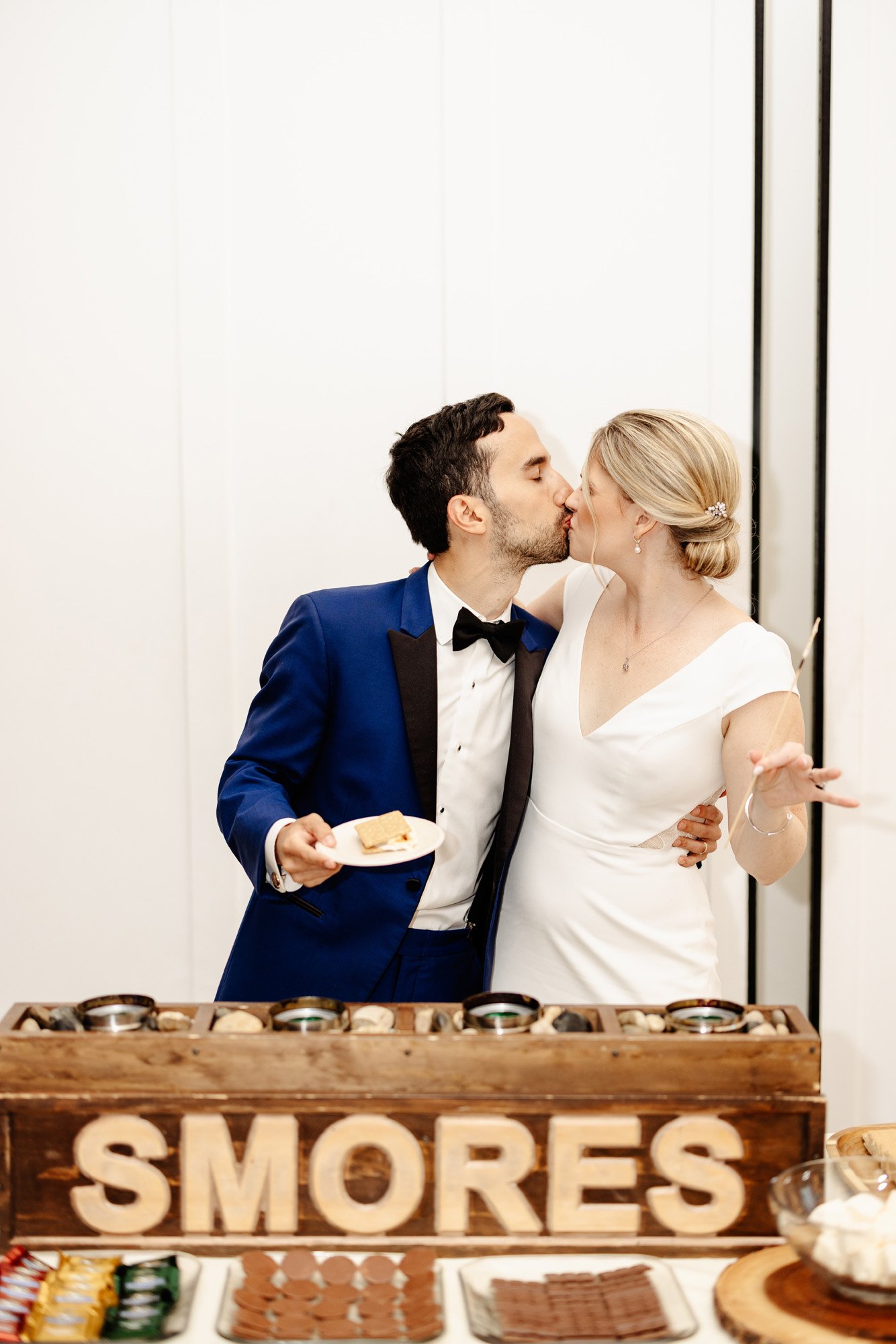 a smores bar during the reception at this clean and crisp wedding featuring a anais anette wedding dress and the groom wearing a blue suit