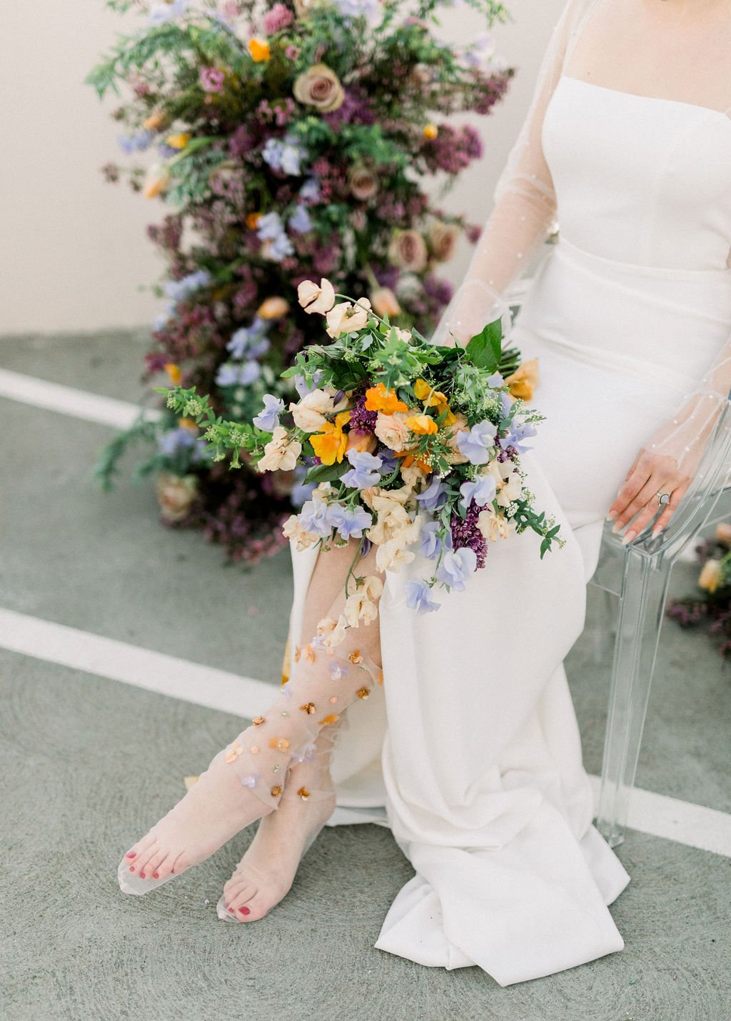 tulle wedding socks with a wild colorful bouquet in this styled modern wedding featuring a wedding dress from aandbe bridal shop