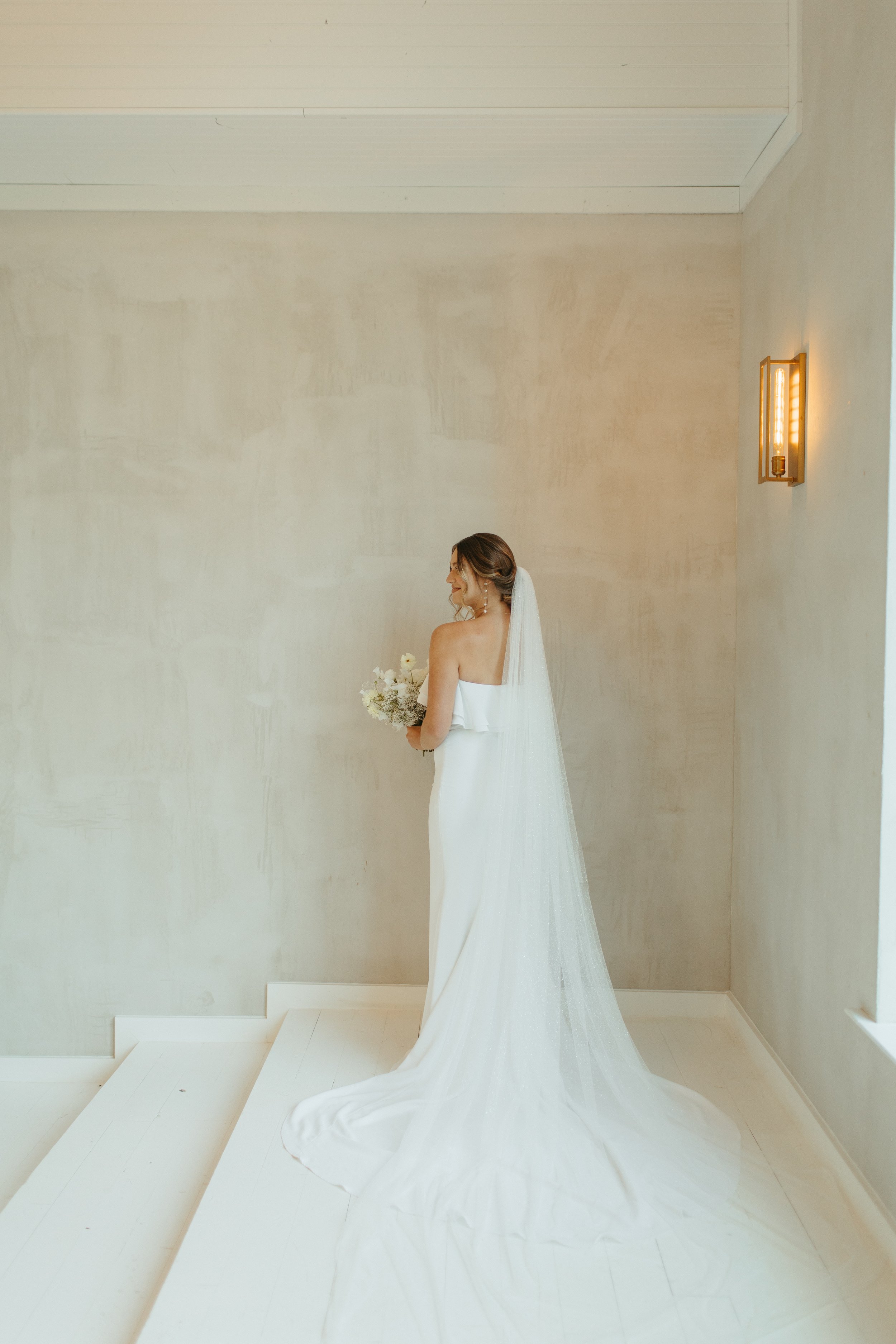 a modern bride wearing alyssa kristin from aandbe dallas bridal shop at the emerson venue