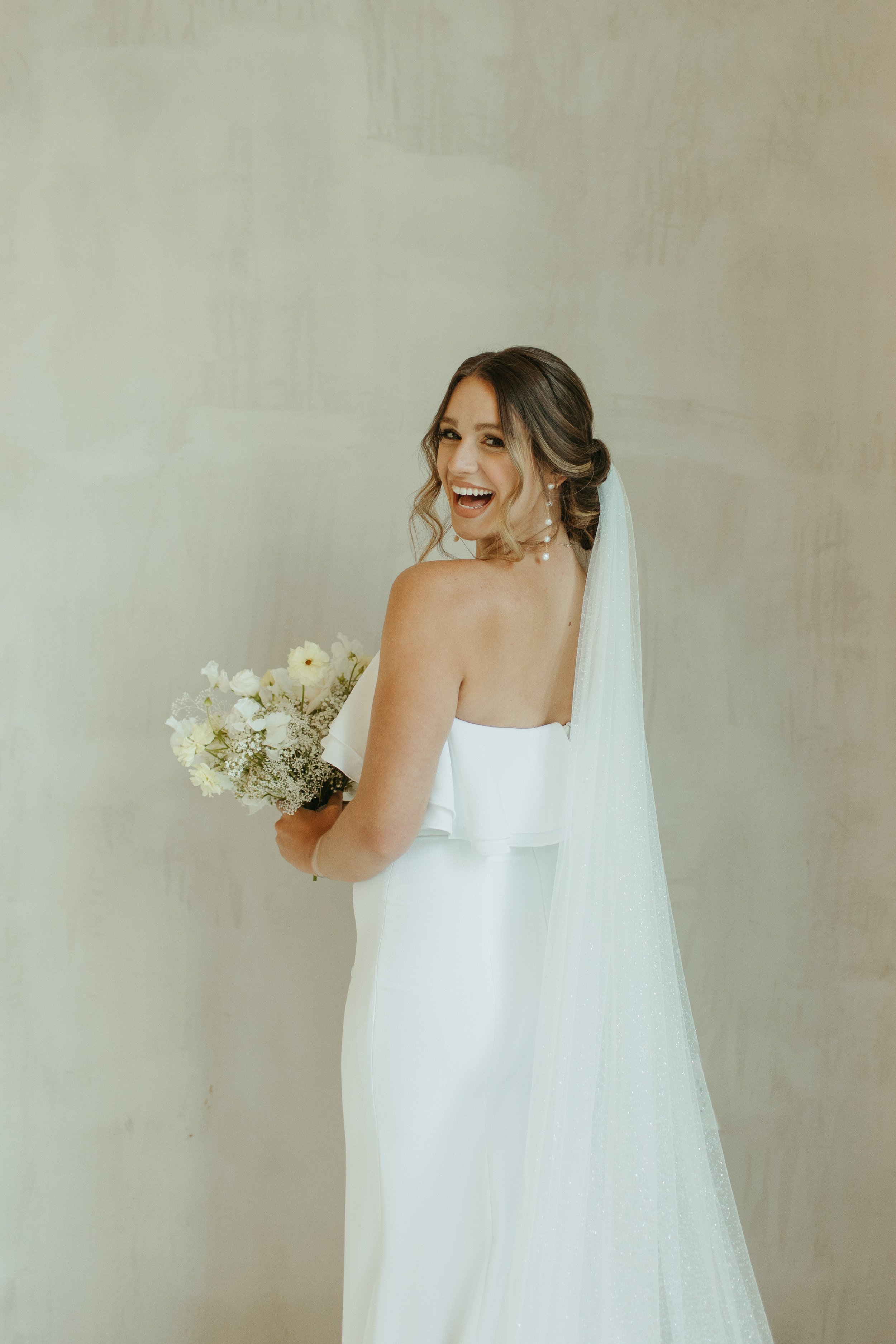 simple and clean crepe wedding dress from aandbe bridal shop dallas featured in this styled shoot at the emerson venue