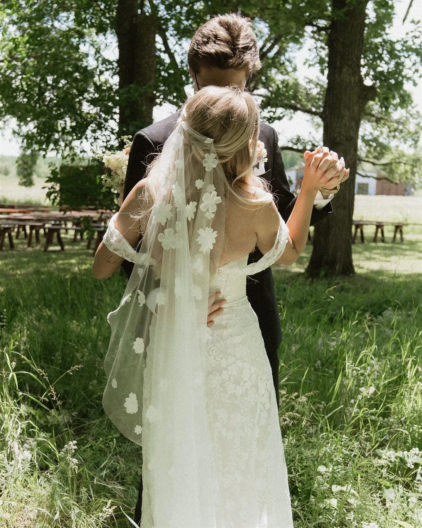 still dreaming of this northern minnesota lodge in the forest where #aandbabe @emily_orak tied the knot 🥂 this summer ceremony was both fun & had all the romance! the ‘cora’ gown & veil by @ruedeseine bridal were the perfect touc