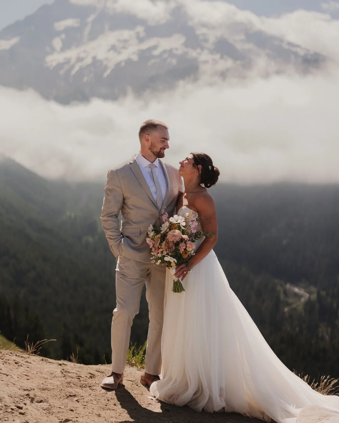 in awe over this stunning day between a&amp;b&eacute; bride emma &amp; joshua, featuring the most beautiful mountain views &amp; @alenaleenabridal 🤍✨

dress | clivia by alena leena via a&amp;b&eacute; #portland
photographer | @purezerophotos

#weddi