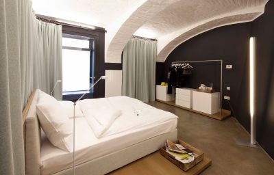 The former artist's loft features tall ceilings, modern amenities and pieces of art work on the walls.