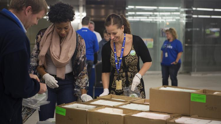 United Airlines employees gathered at the carrier's Willis Tower headquarters to pack hygiene kits. Credit: United