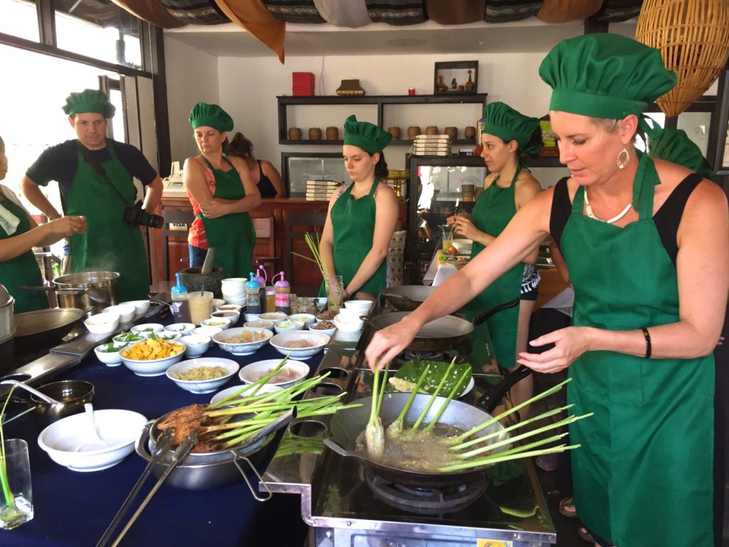 Hard at work learning to make Lao cuisine for lunch!