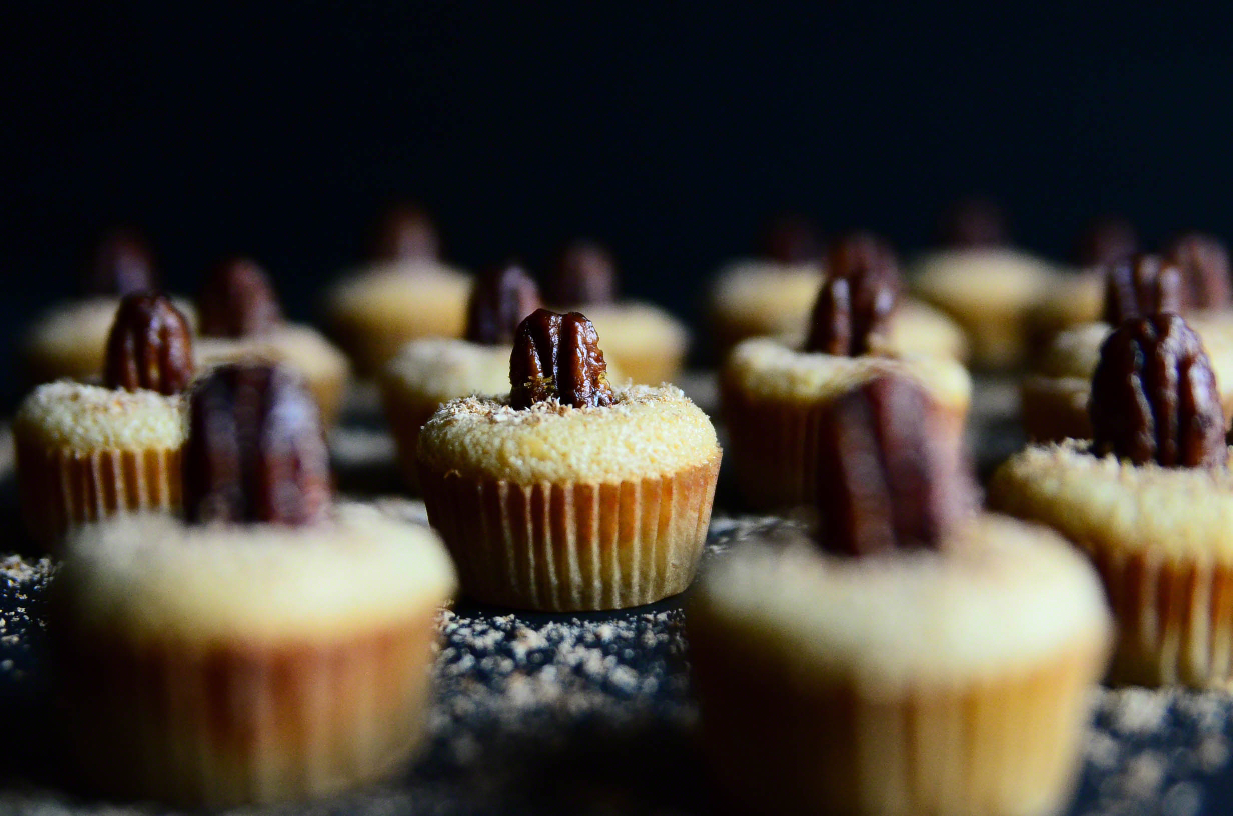 Honey Butter Bourbon Pecan Chess Mini Muffin Poppers topped with Nutmeg