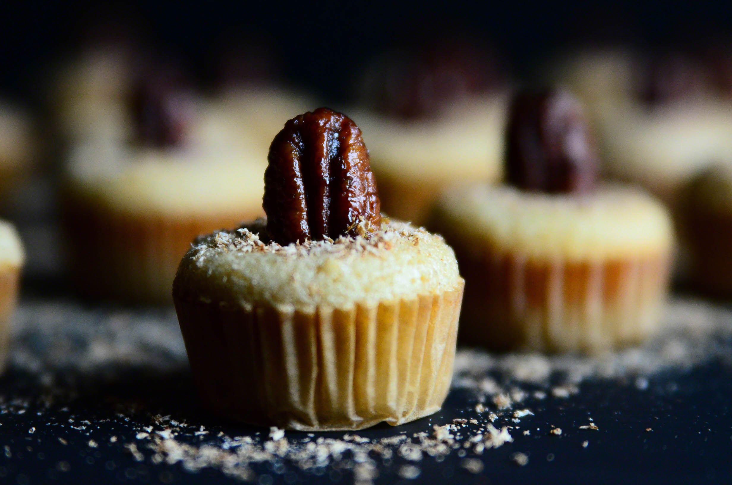 Honey Butter Bourbon Pecan Chess Mini Muffin Poppers topped with Nutmeg