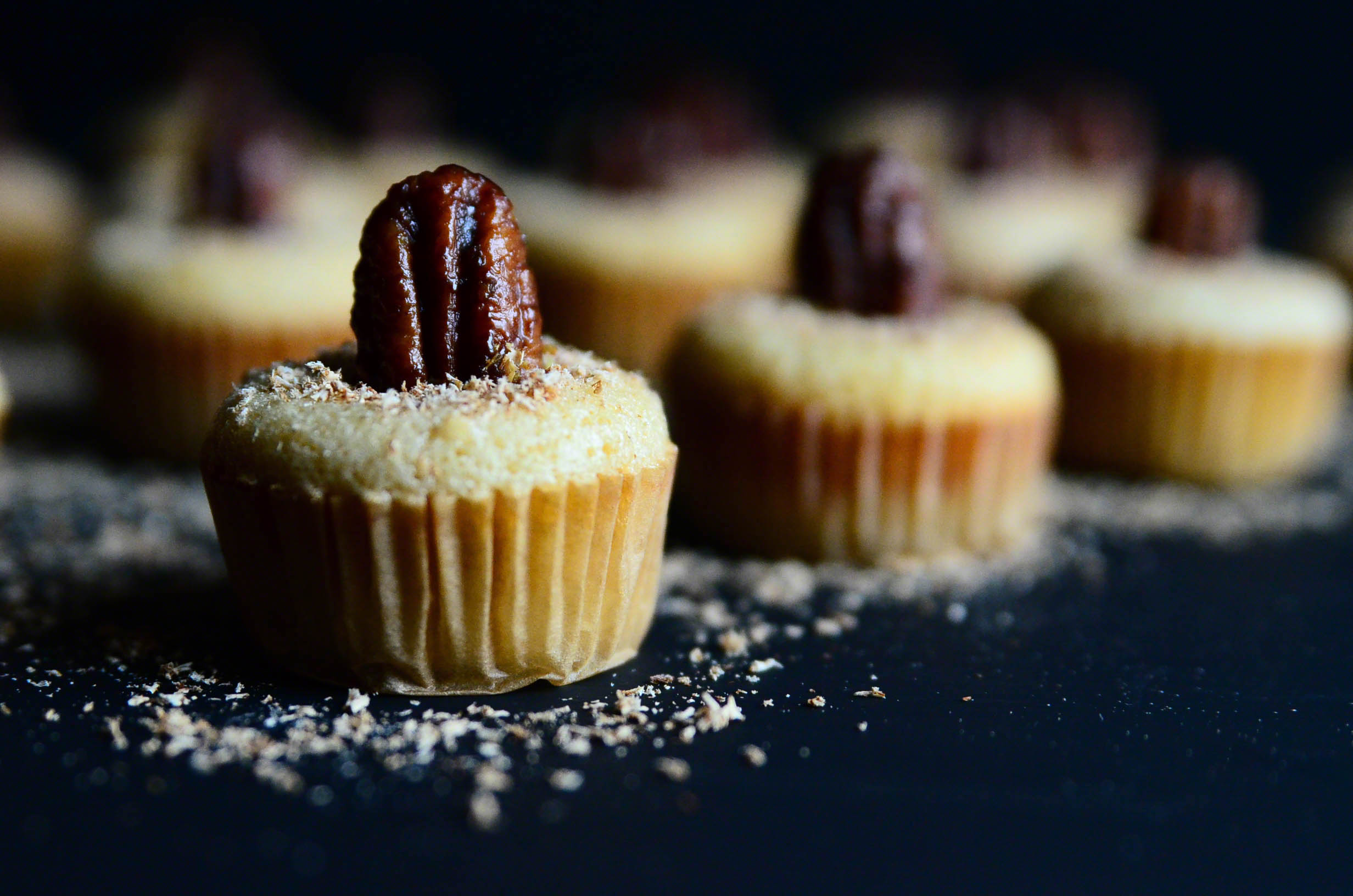 Honey Butter Bourbon Pecan Chess Mini Muffin Poppers topped with Nutmeg