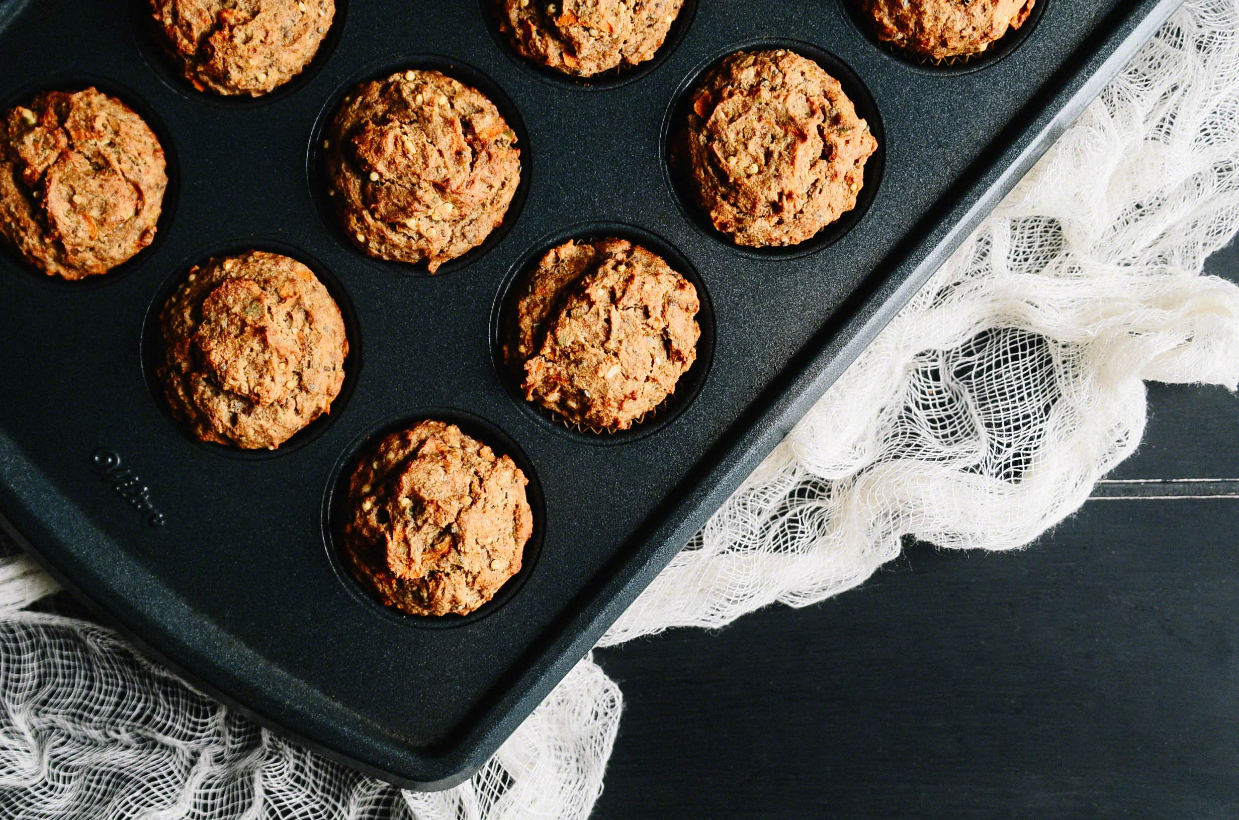 Three Seed Morning Muffins topped with Coconut Buttercream and Dehydrated Strawberries(Vegan + GF)