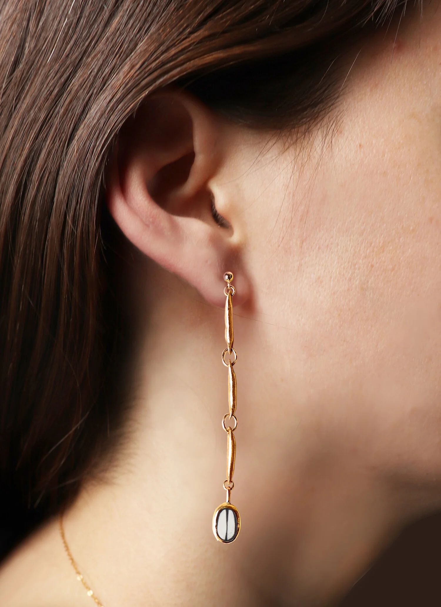 Link_Seed_Earrings_White_Model_Sm.jpg