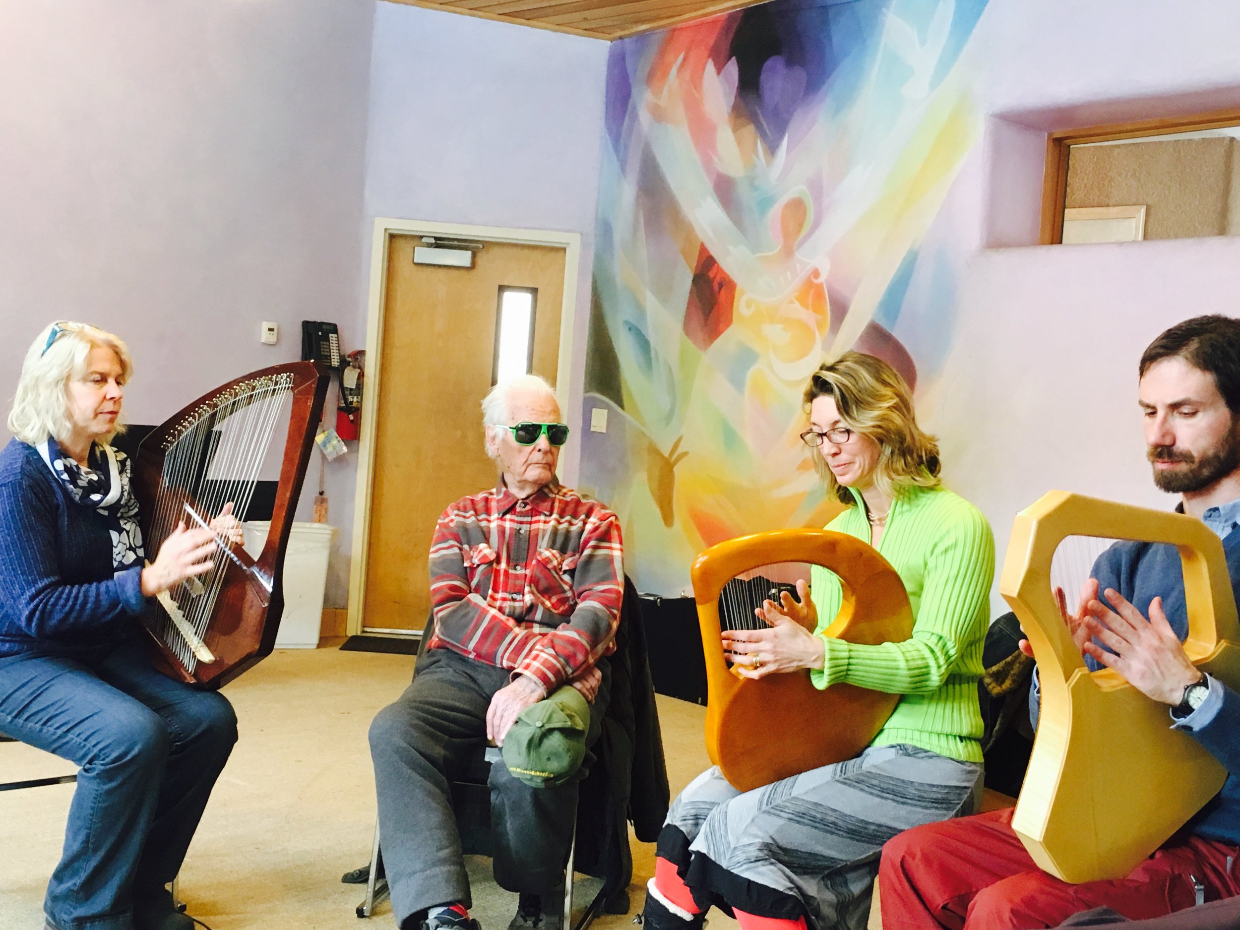 Pictured from left to right: Lorraine Curry, Hartmut Schiffer, Holly Richardson and Baruch Simon. Orpheus painted on the wall behind by local artist, Charles Andrade. Thank you to Itzel Salazar for taking the photo. (Itzel wants to learn to play!)
