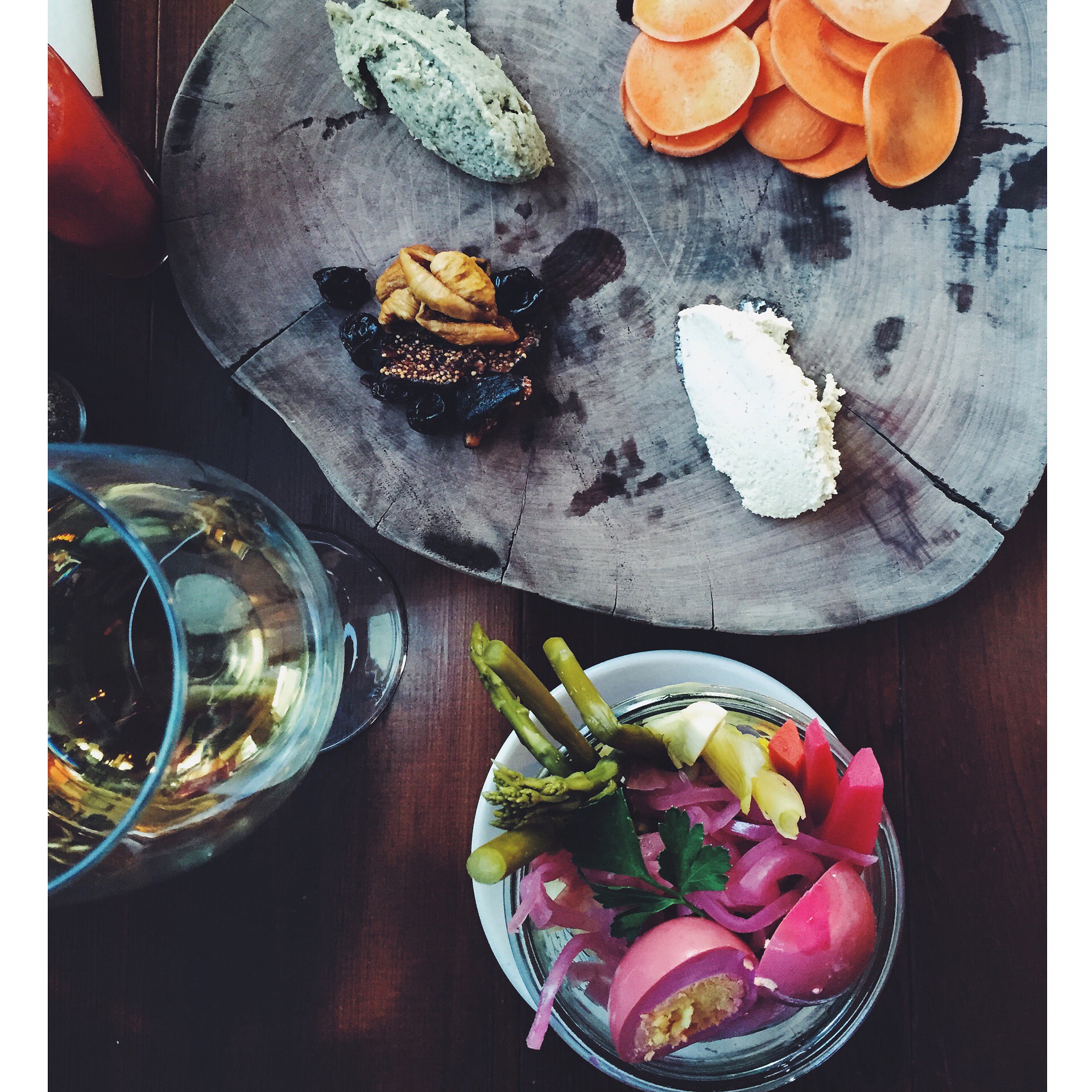 Pickled vegetables and egg plate and vegan board with cashew cheese, hemp seed paté, dried fruit, and spiced yam chips at Cremer House .