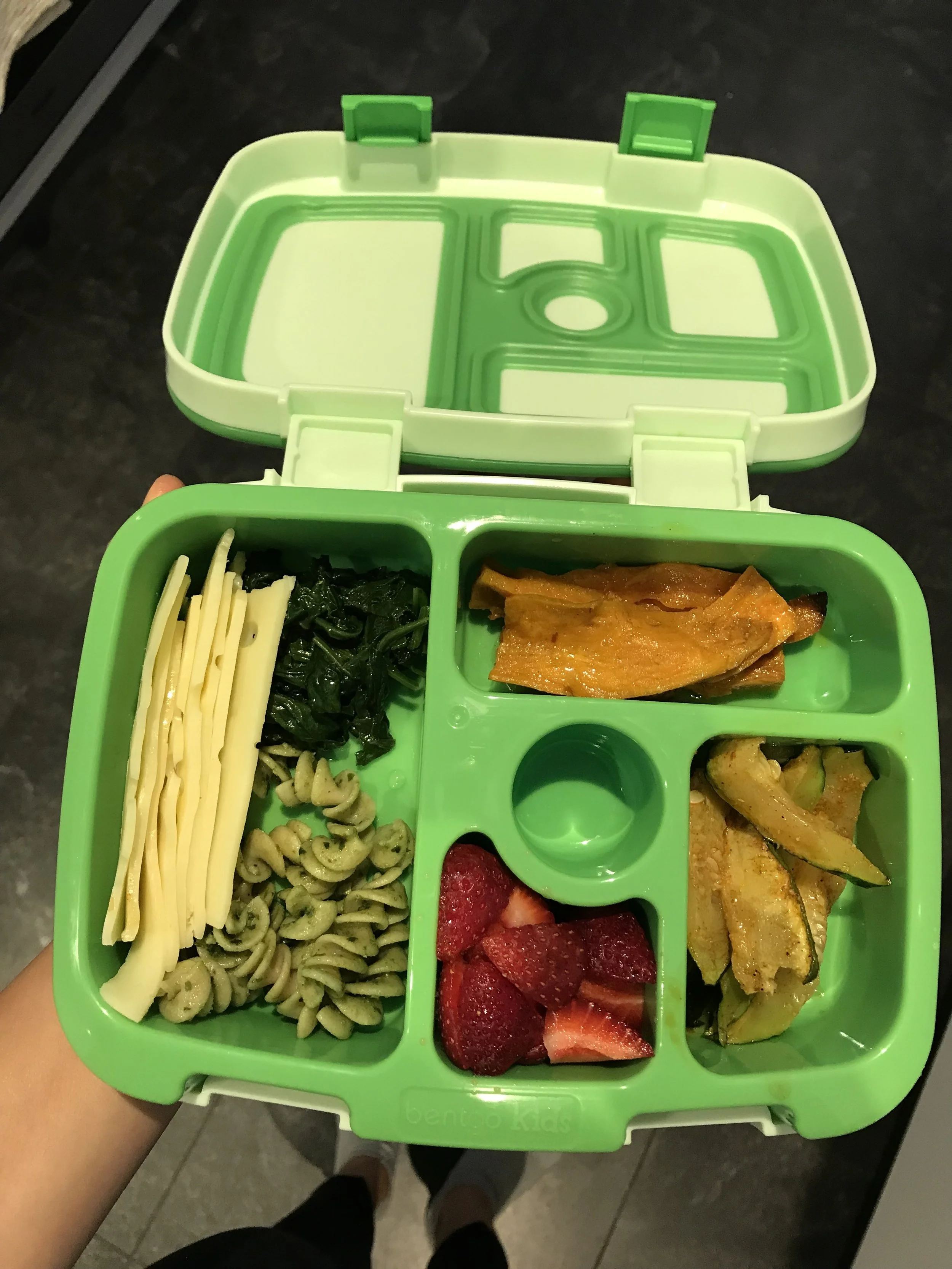 Organic Swiss cheese, sautéd spinach, kamut spirals with pesto, roasted zucchini, roasted sweet potatoes, and strawberries.