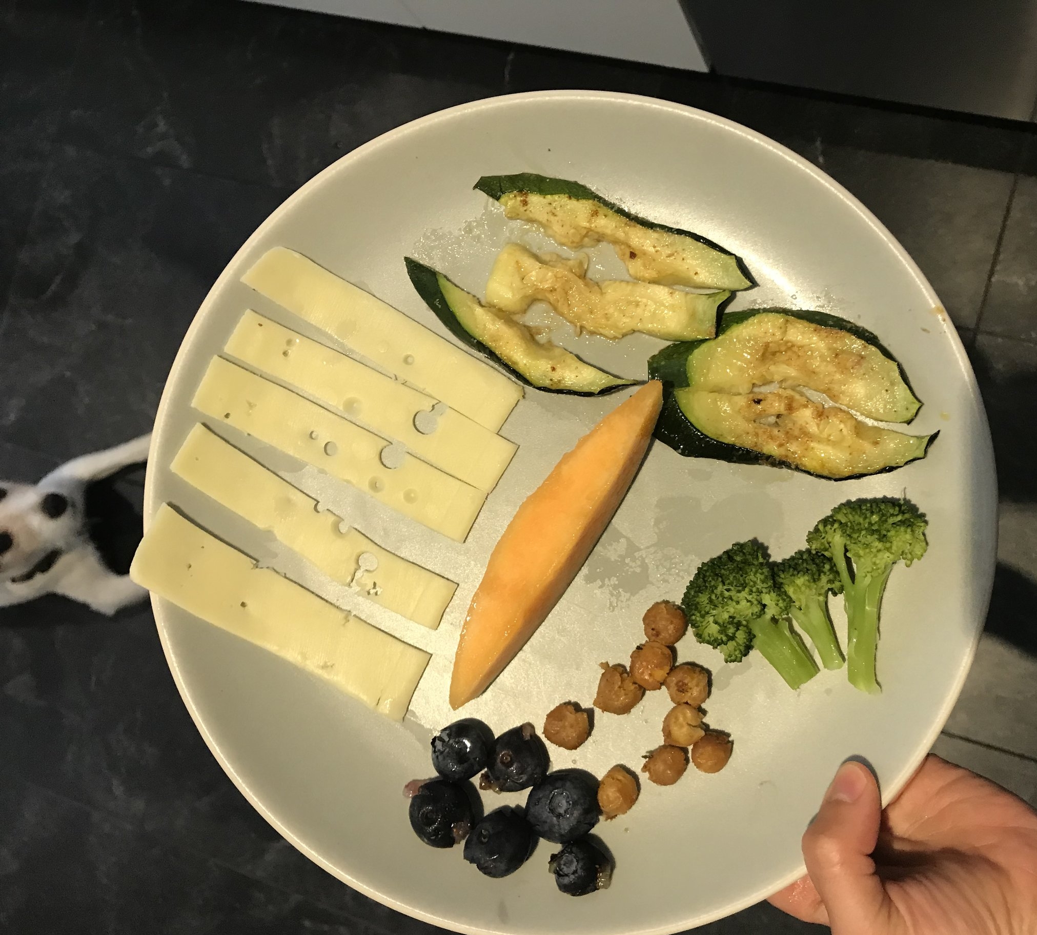 Swiss cheese, squished blueberries, squished spice roasted chickpeas, steamed broccoli, roasted zucchini, and cantaloupe