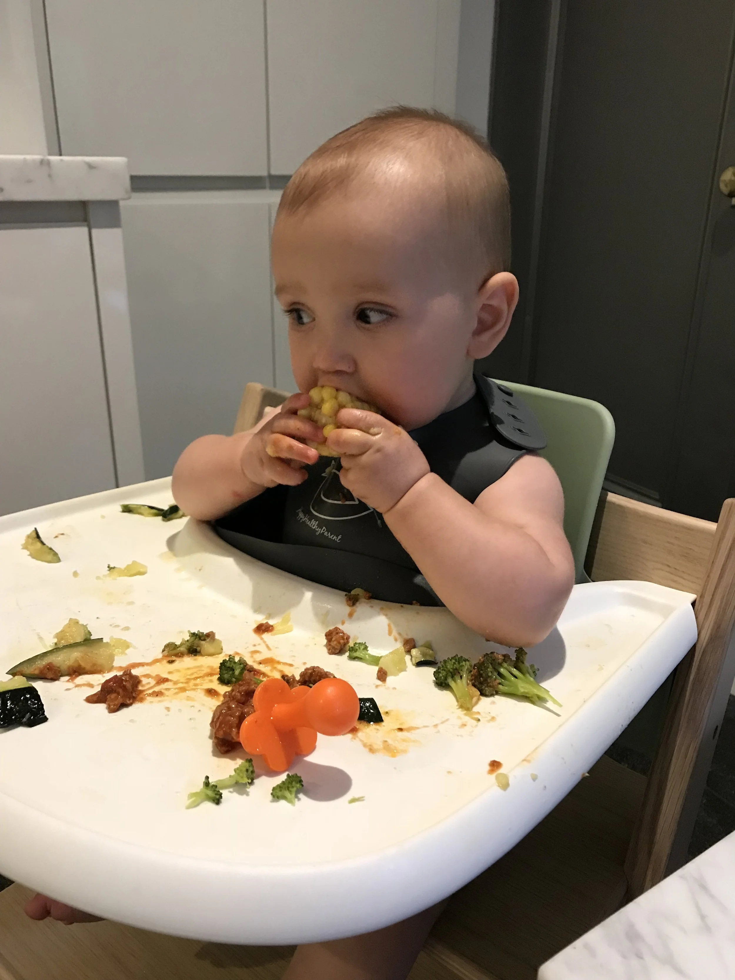 Jack enjoying some corn on the cob for the first time.