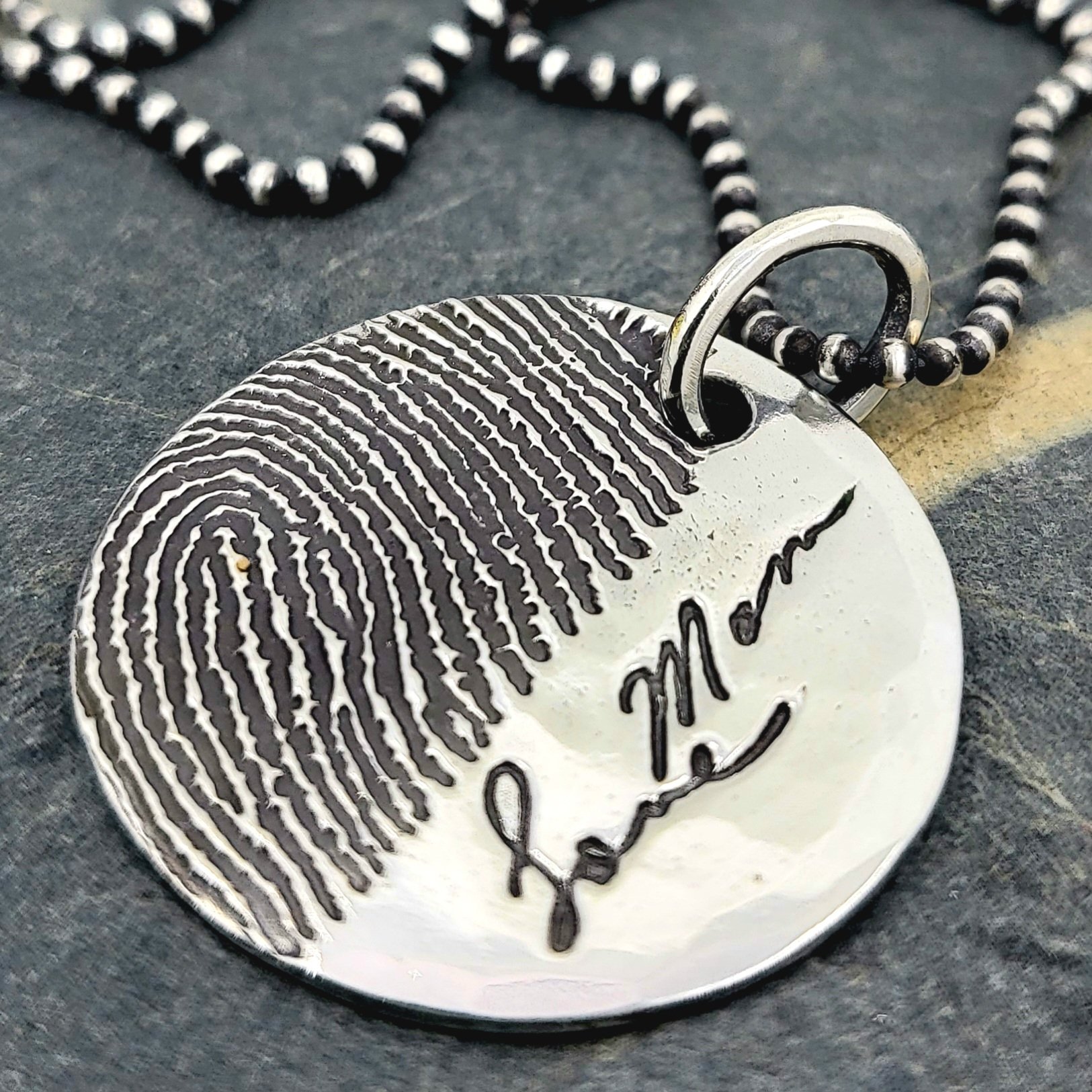Custom engraving a fingerprint on a photo engraved pendant