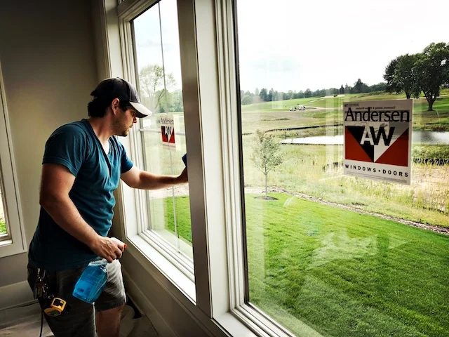 Union Set Dresser Bryan Bredahl, preps the window for camera.