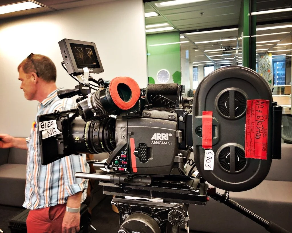 DGA Assistant Director TJ Beagan works near the 35 mm film camera for the Google Startups.