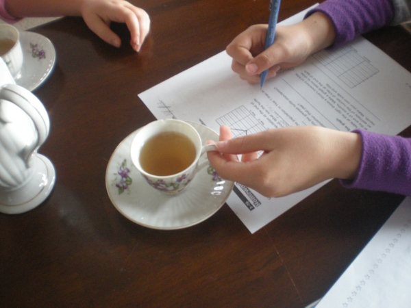 Getting down to work after school with a tasty cuppa tea.
