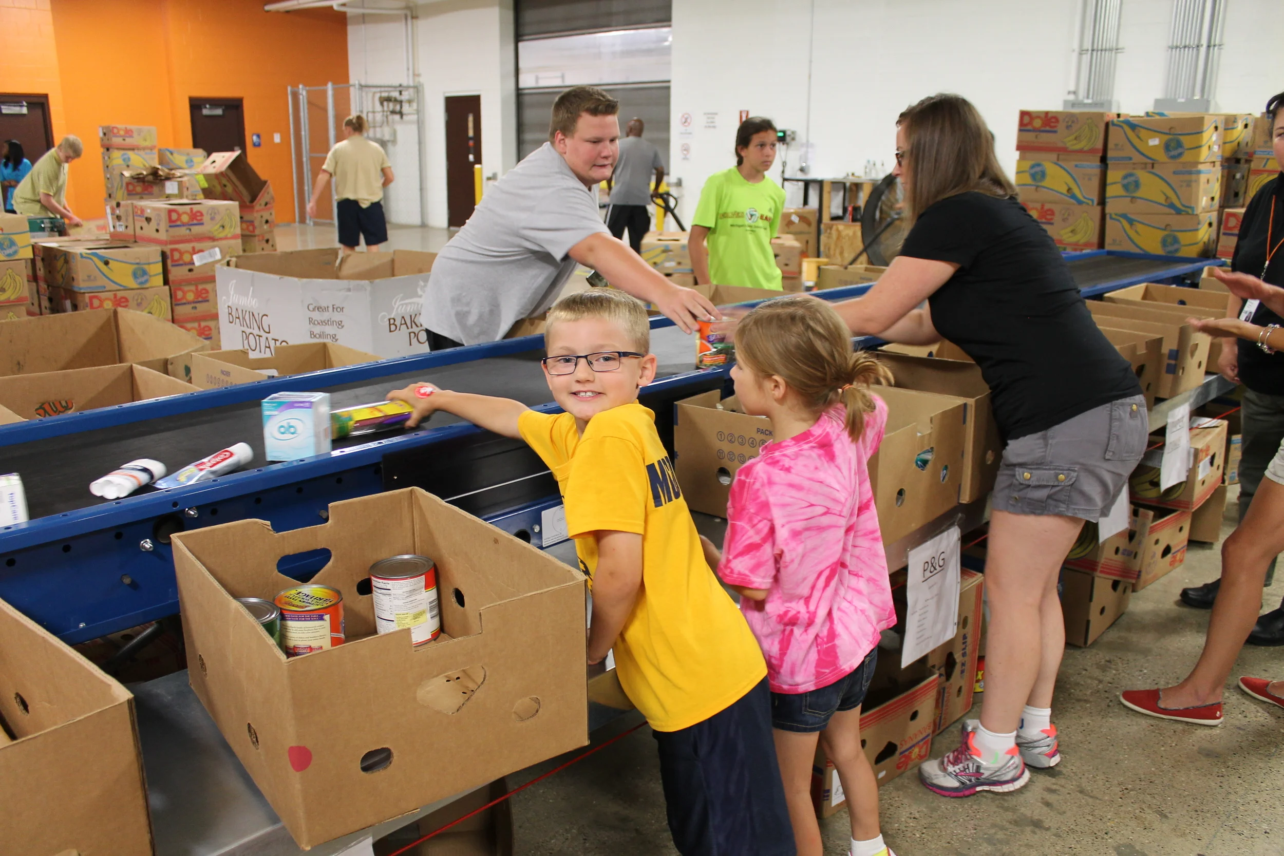 Volunteers working hard in the new reclamation/repackaging warehouse.