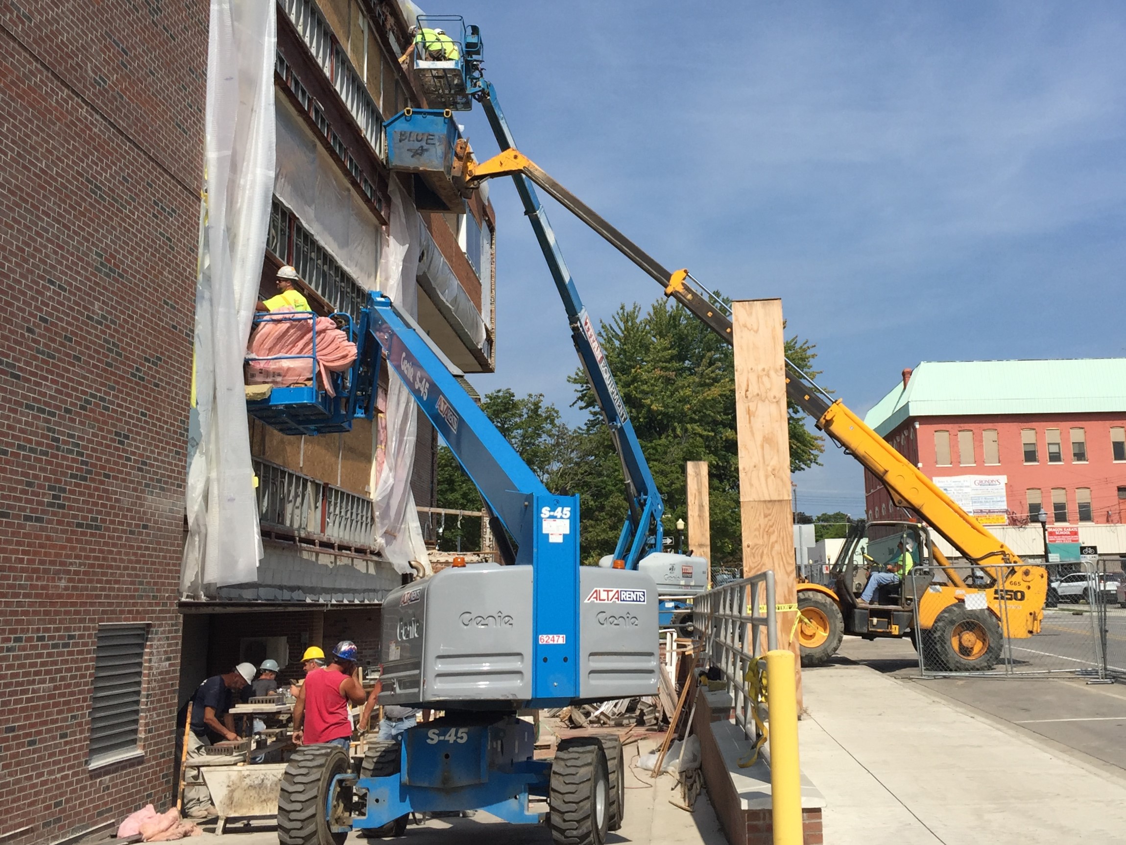 Prepping for new windows, finishing brick work, and installation of new windows.