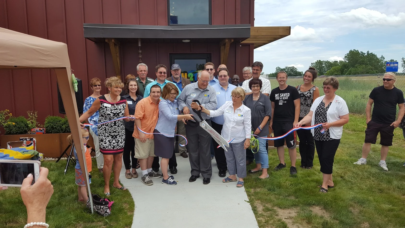 Friends, family, and local dignitaries help celebrate the grand opening of our new office in Davison.