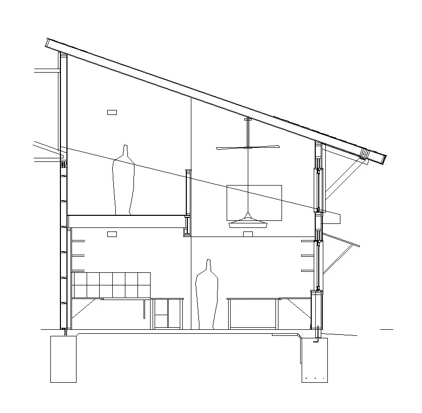 A section cut through the office shows the loft storage space above the work stations. Every attempt to maximize space and introduce design elements was considered during the design process.