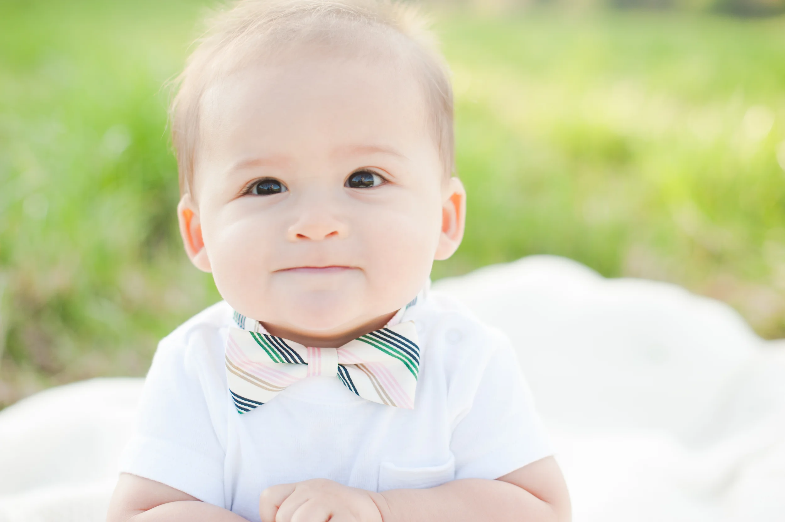 "I love the closeup of his face, the sweetness in his eyes, and the little bow tie. This picture makes me just wanna squeeeezee his little cheeks!"- Ngoc on her favorite portrait