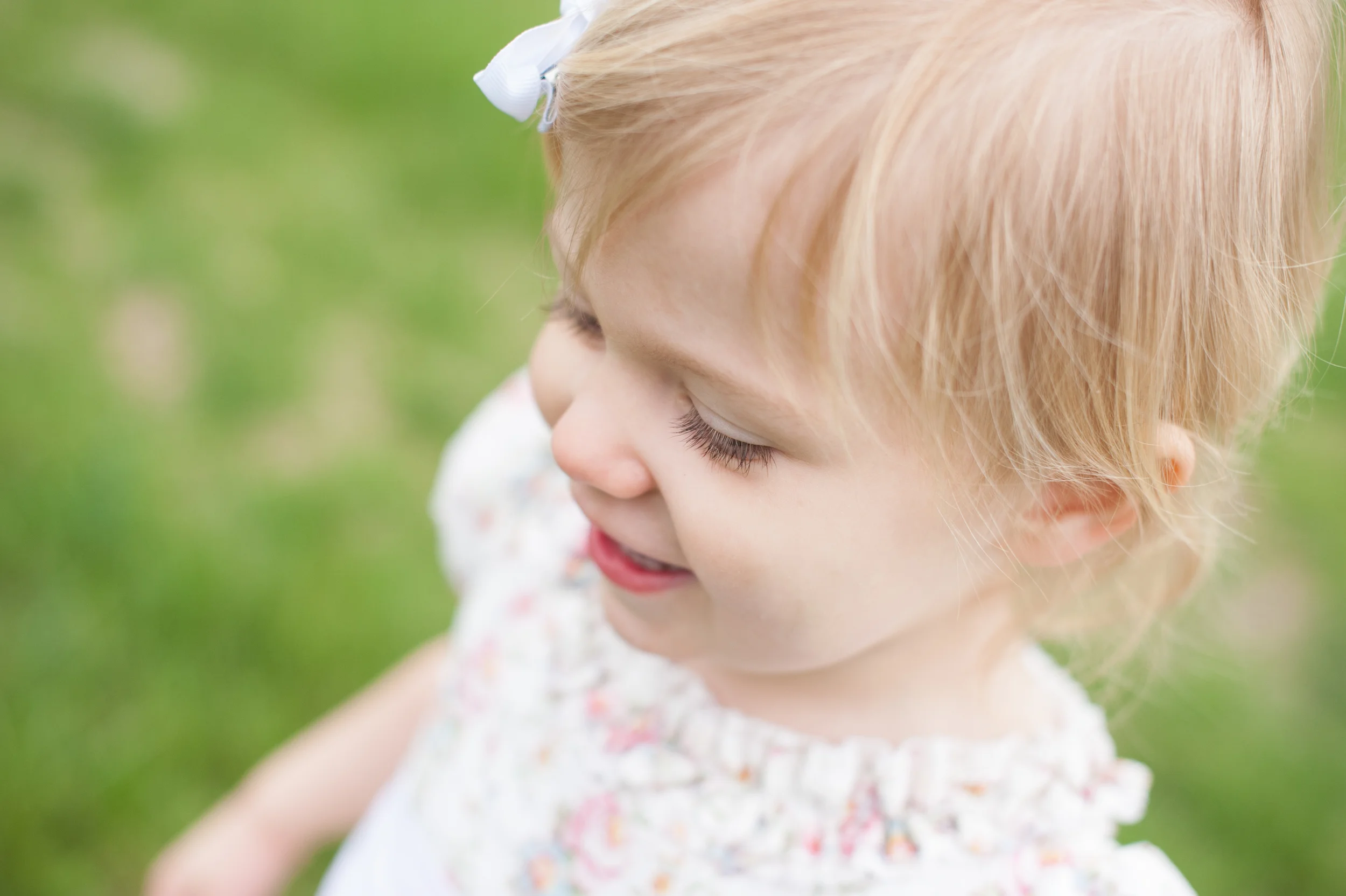 Corie on her final favorite, "...because it shows Raleigh's sweet face (and long lashes!) in a way that I often see it, but can't her to sit still ing enough to capture."