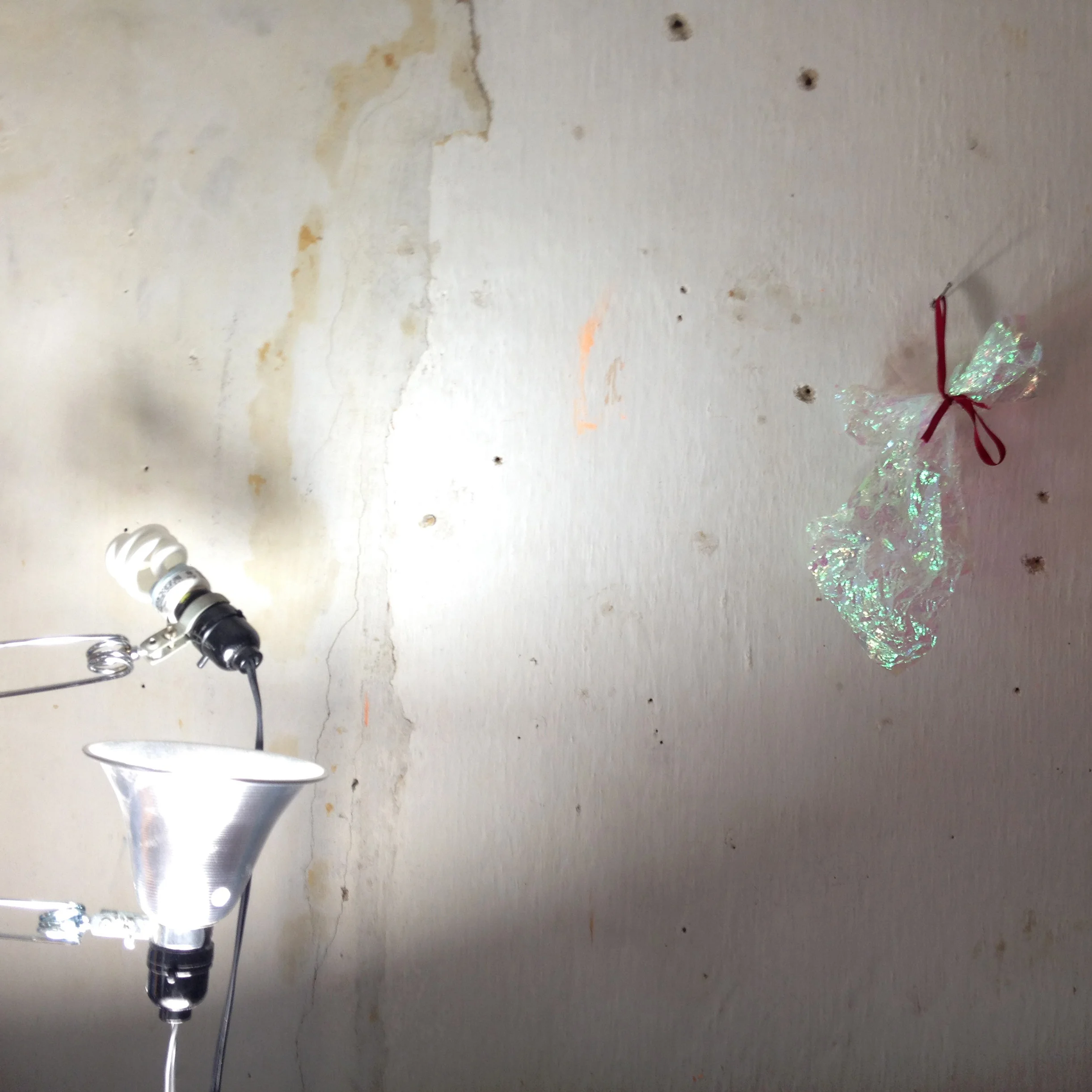 studio wall + lamps + wrapper + red ribbon