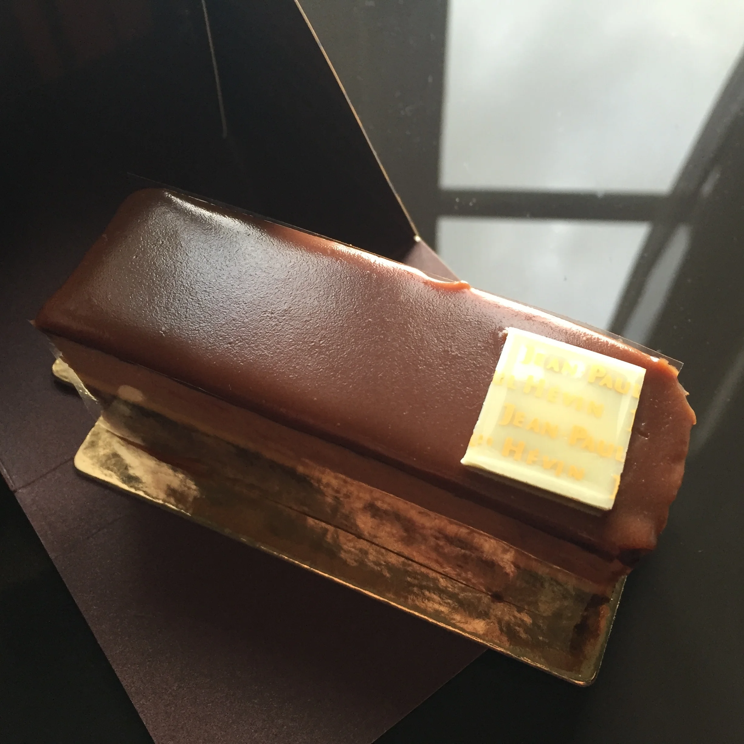 The Bergamote: a crisp base layered with dark chocolate ganache, chocolate cake, bergamot orange cream, Earl Grey milk chocolate and finished with a milk chocolate glaze
