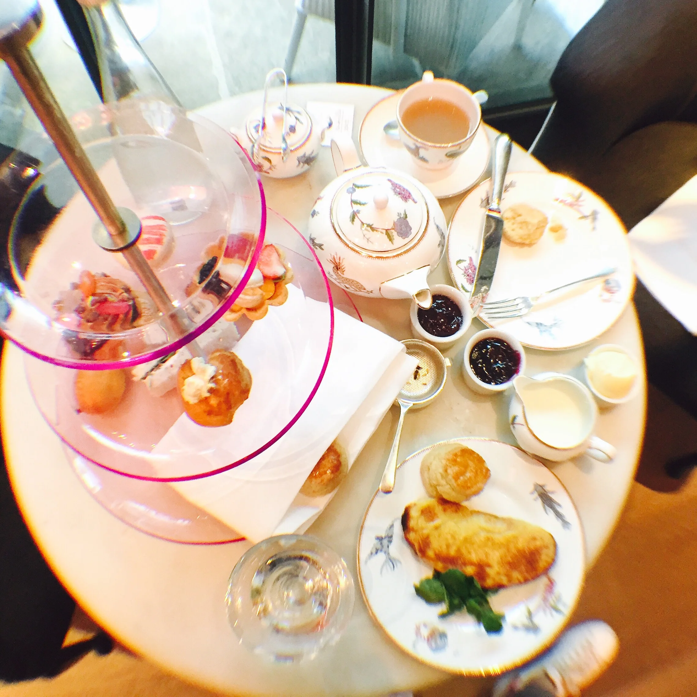 I'm not really a girly-girl but even I had to admit the transparent pink tray and prancing mythical creatures printed on the gold-rimmed ceramic plates and teacups were pretty darn cute.