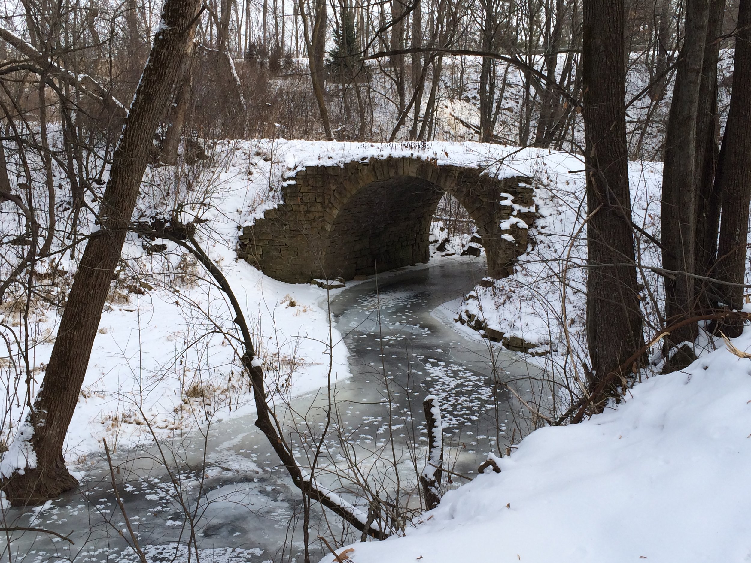 A frozen Brown's Creek at the Stone ARch Bridge.JPG