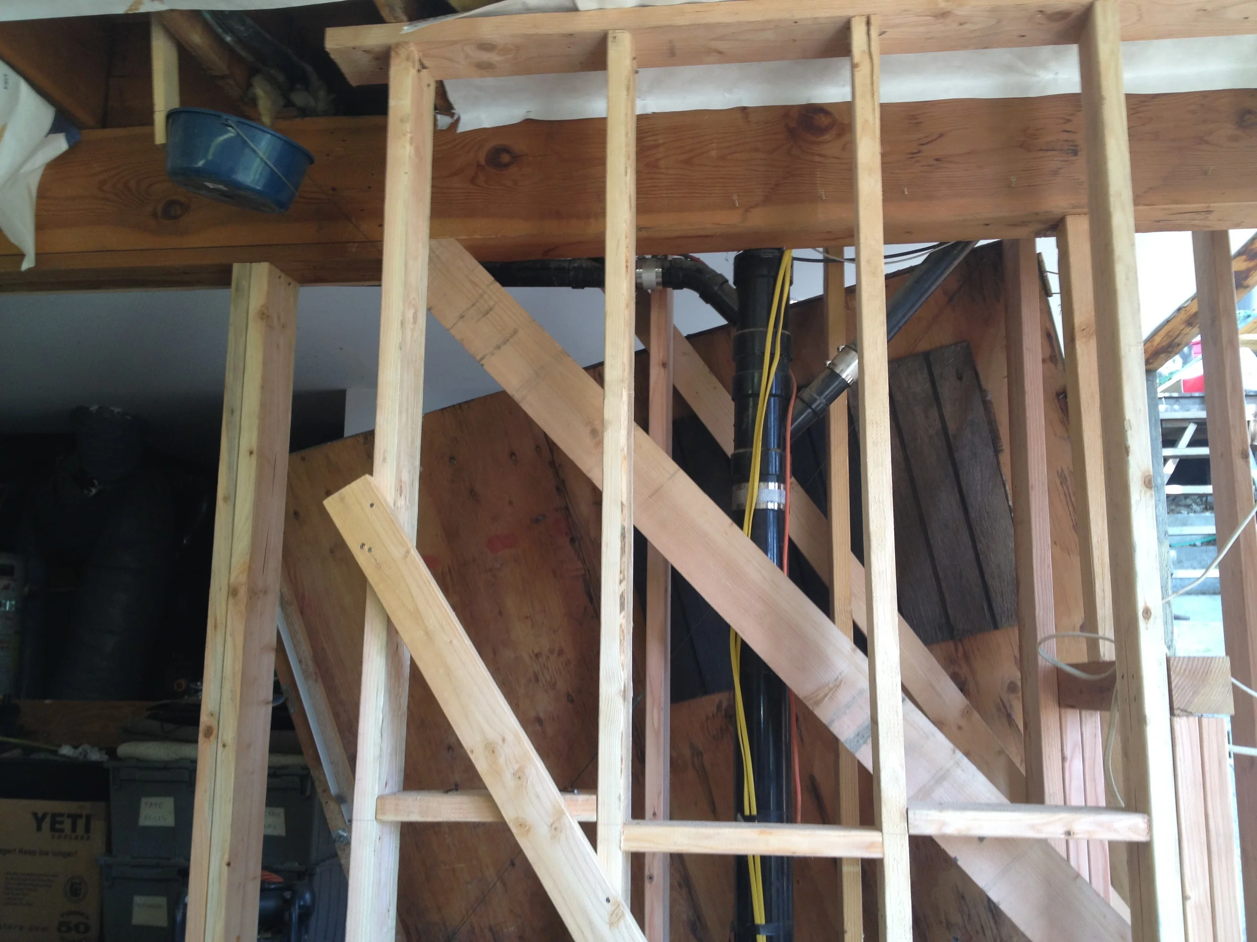  Temporary shoring walls propped up the house while we removed the offending lumber. Here we've already slid the new brace into position. 